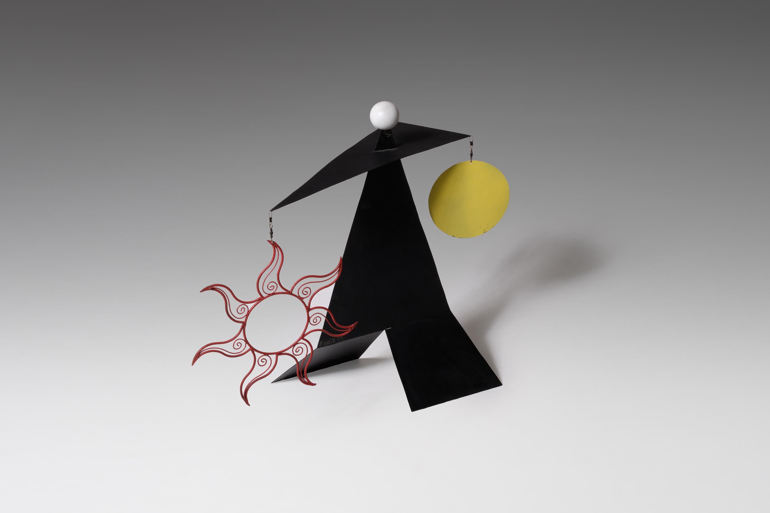 Mobile sculpture form France, 1971, made from sheet metal which is cutout in serval interesting shaped and painted in primary colors. On top rest a white lacquered wooden ball. The combination of colors, material shapes creating an interesting and