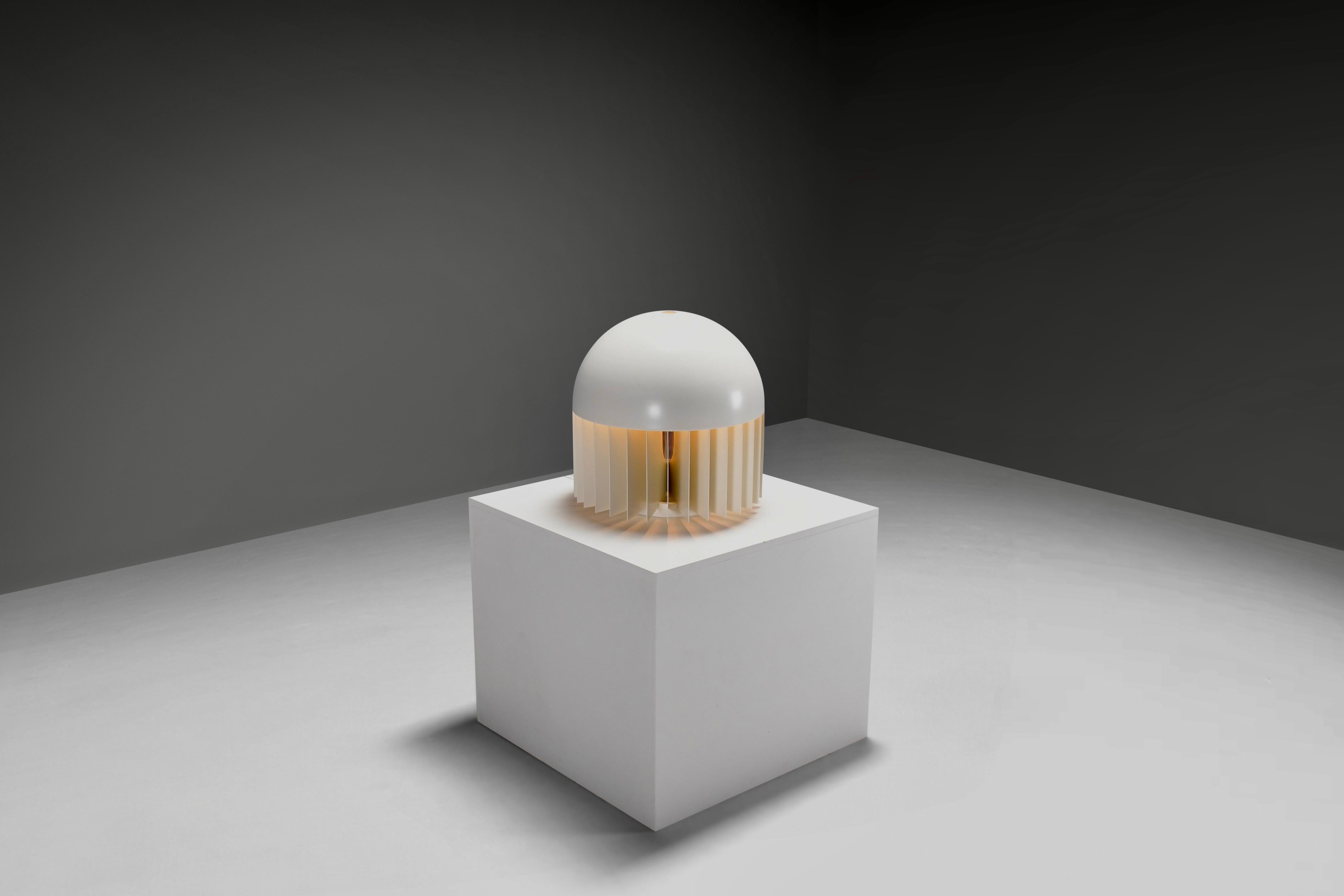 Striking and sculptural ‘MT’ table or floor lamp, designed in 1969 by the renowned Italian architect, designer, and urban planner Giancarlo Mattioli. 

New old stock.

Manufactured by the Italian Sirrah company.

This impressive piece is in
