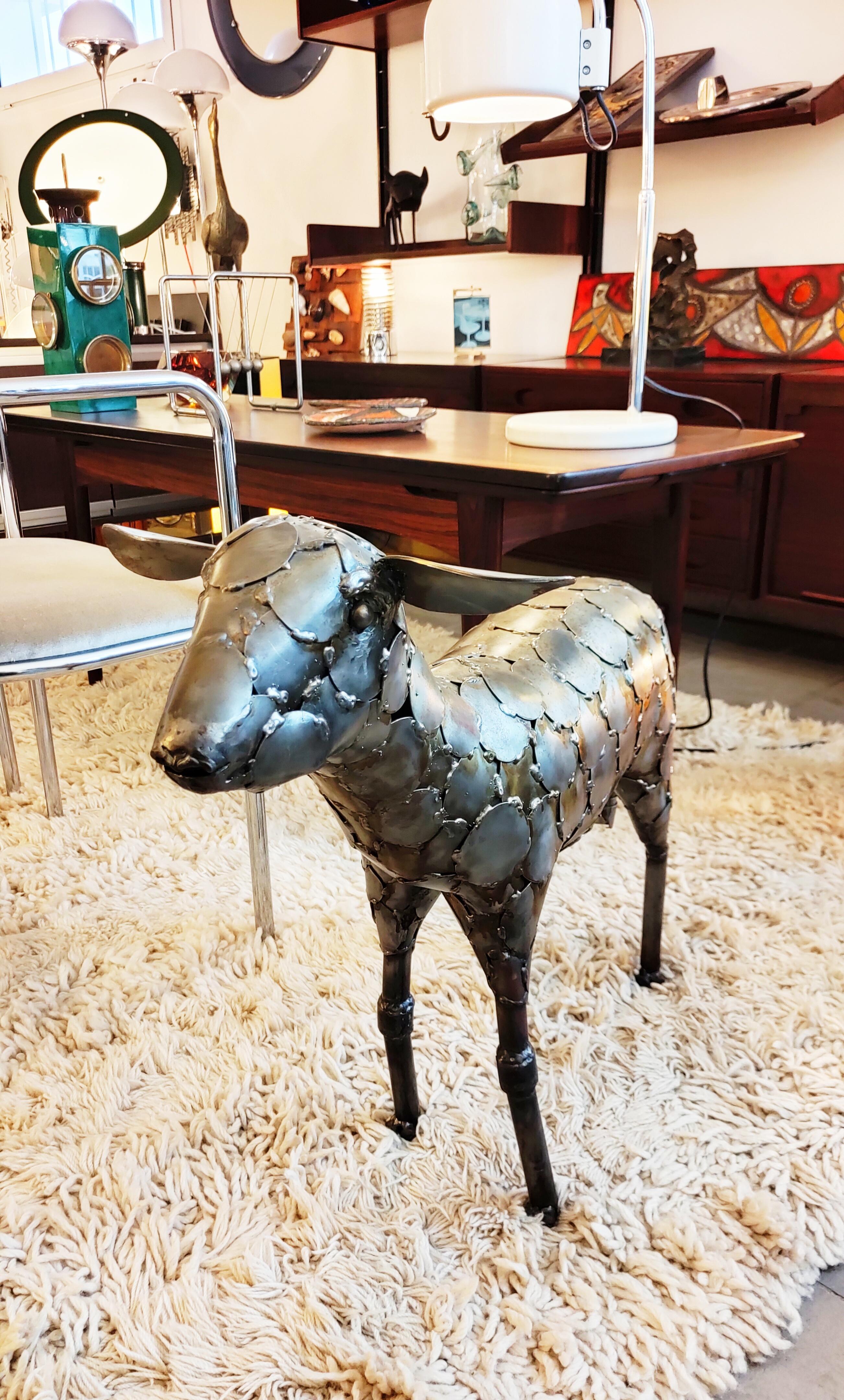 Beautiful and rare, large metal sheep sculpture manufactured in Spain in 1970s.
This sheep transcribes an incredible very realistic expression, this work is really very well done.