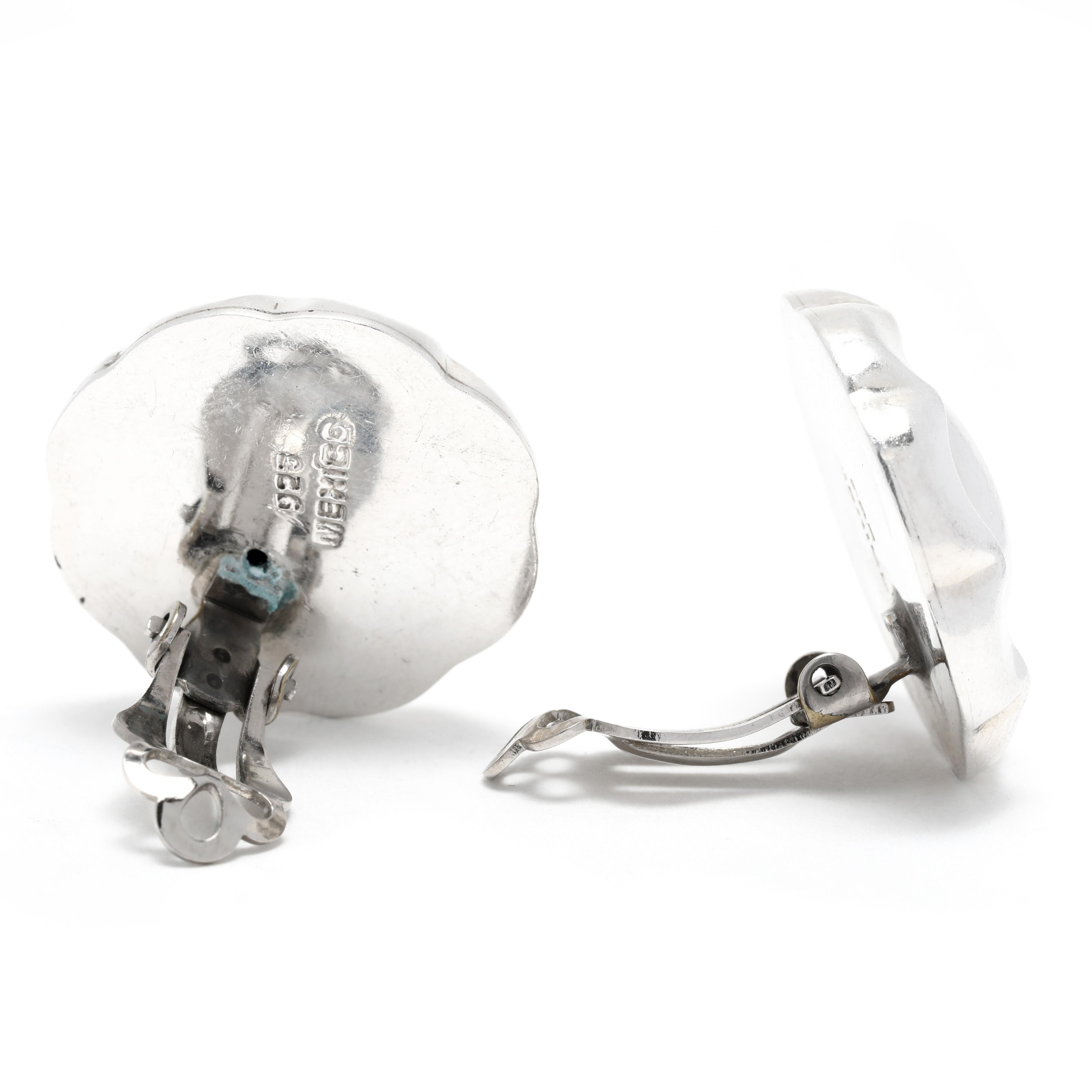 These beautiful Large Mexican Dome Clip On Earrings are handcrafted from sterling silver and measure 1 inch in length. Whether you're going to work or out for a night on the town, these silver clip ons are the perfect accessory to add a touch of