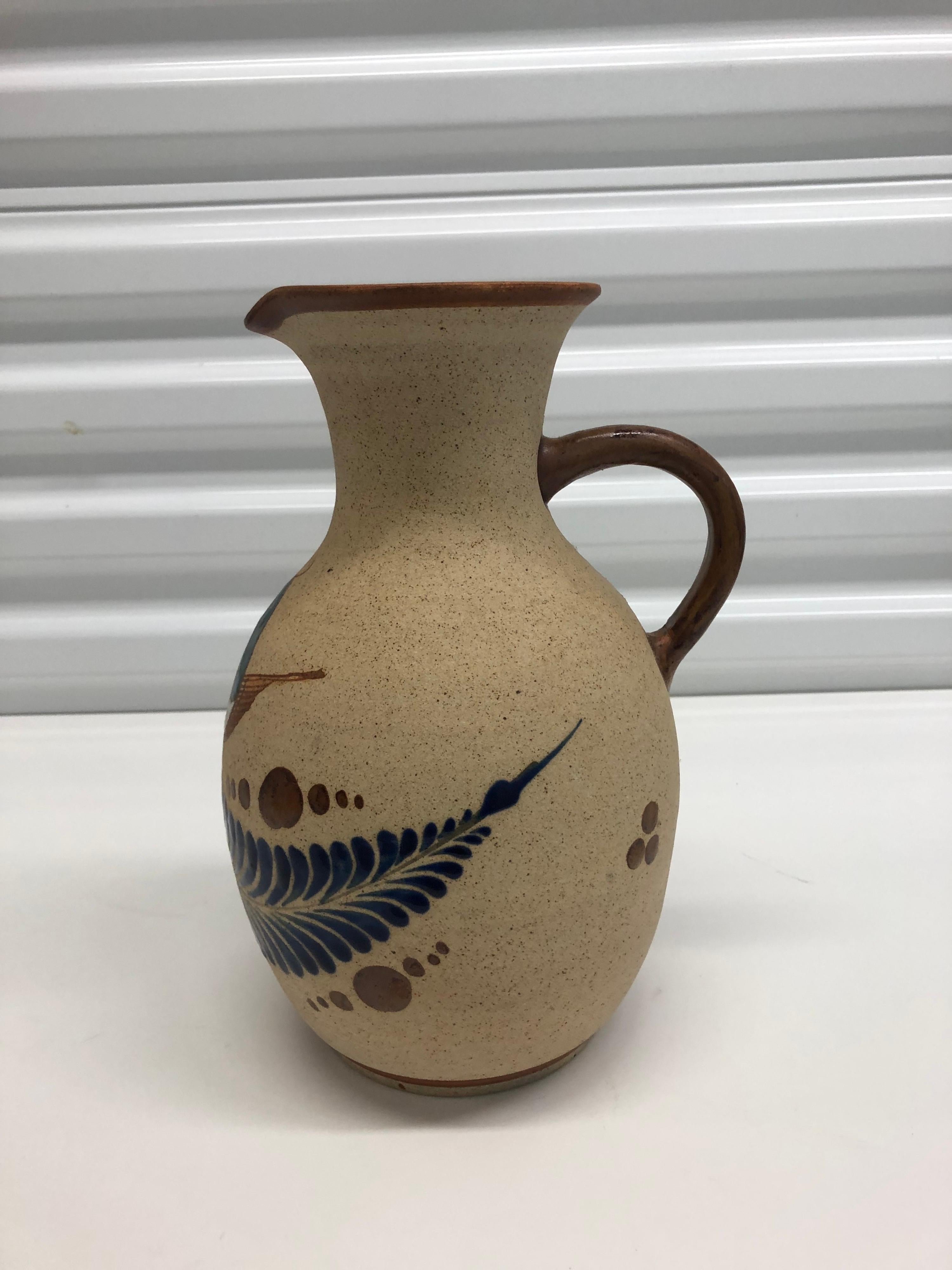 Large Mexican Tonala water jug.
Fully glazed inside, depicting bird and feather.
In shades of royal blue, green, brown and white.
Size: 11