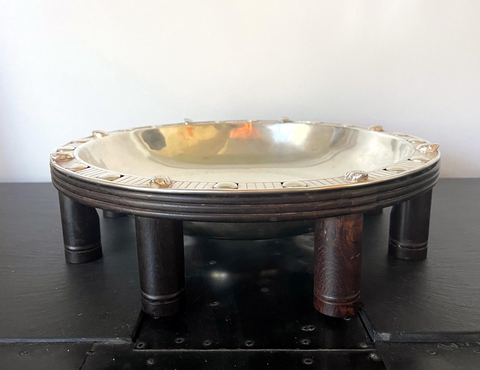An impressive Mexican modern Mexican center bowl on fitted wood stand by William Spratling (1900-1967) circa 1962-64. Spratling is known for his modern approach of silver design and efforts in revitalizing Taxco silver industry. This rare large