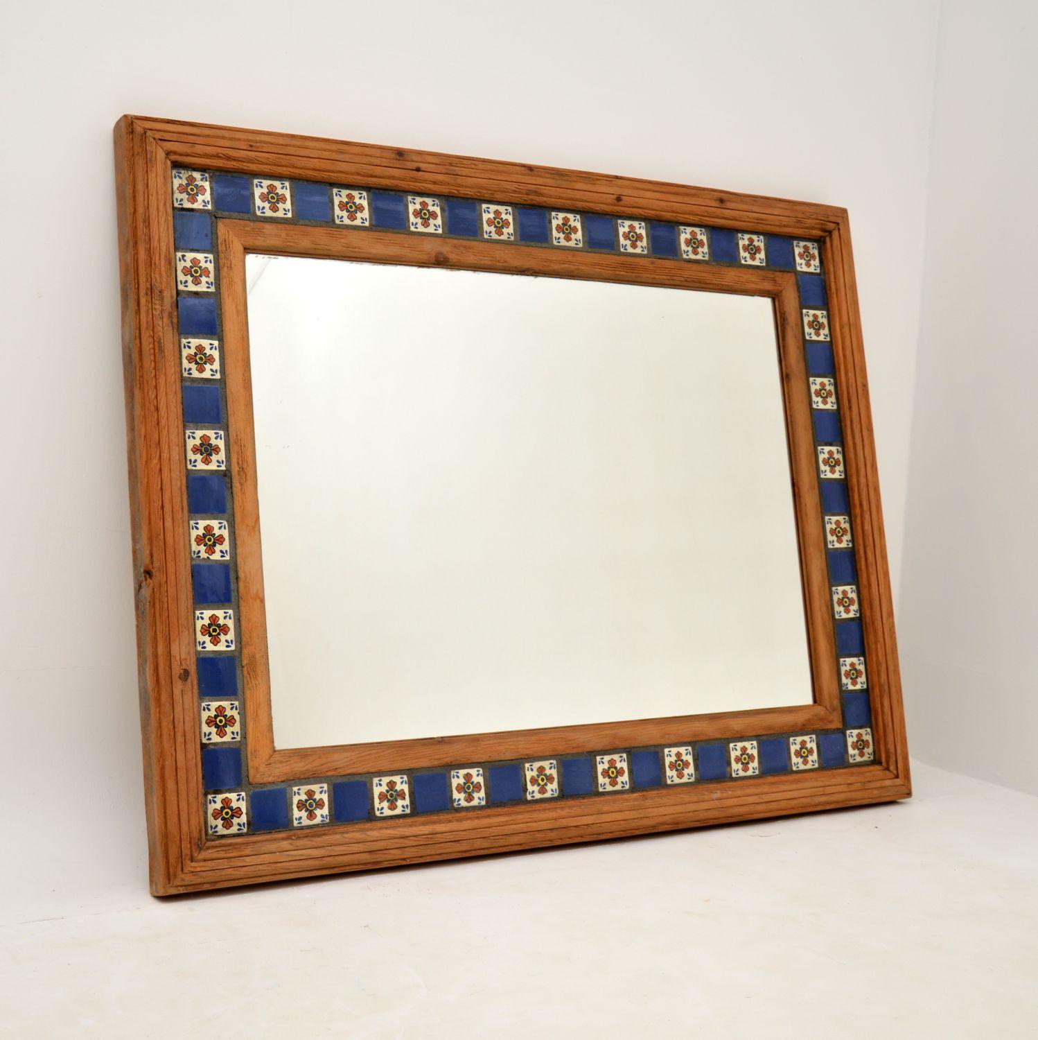 A large and stunning vintage mirror, made in Mexico and dating from around the 1950-60’s.

It is beautifully made from solid wood with a gorgeous inset tiled border.

The quality is excellent and this is a really striking piece, with vibrant