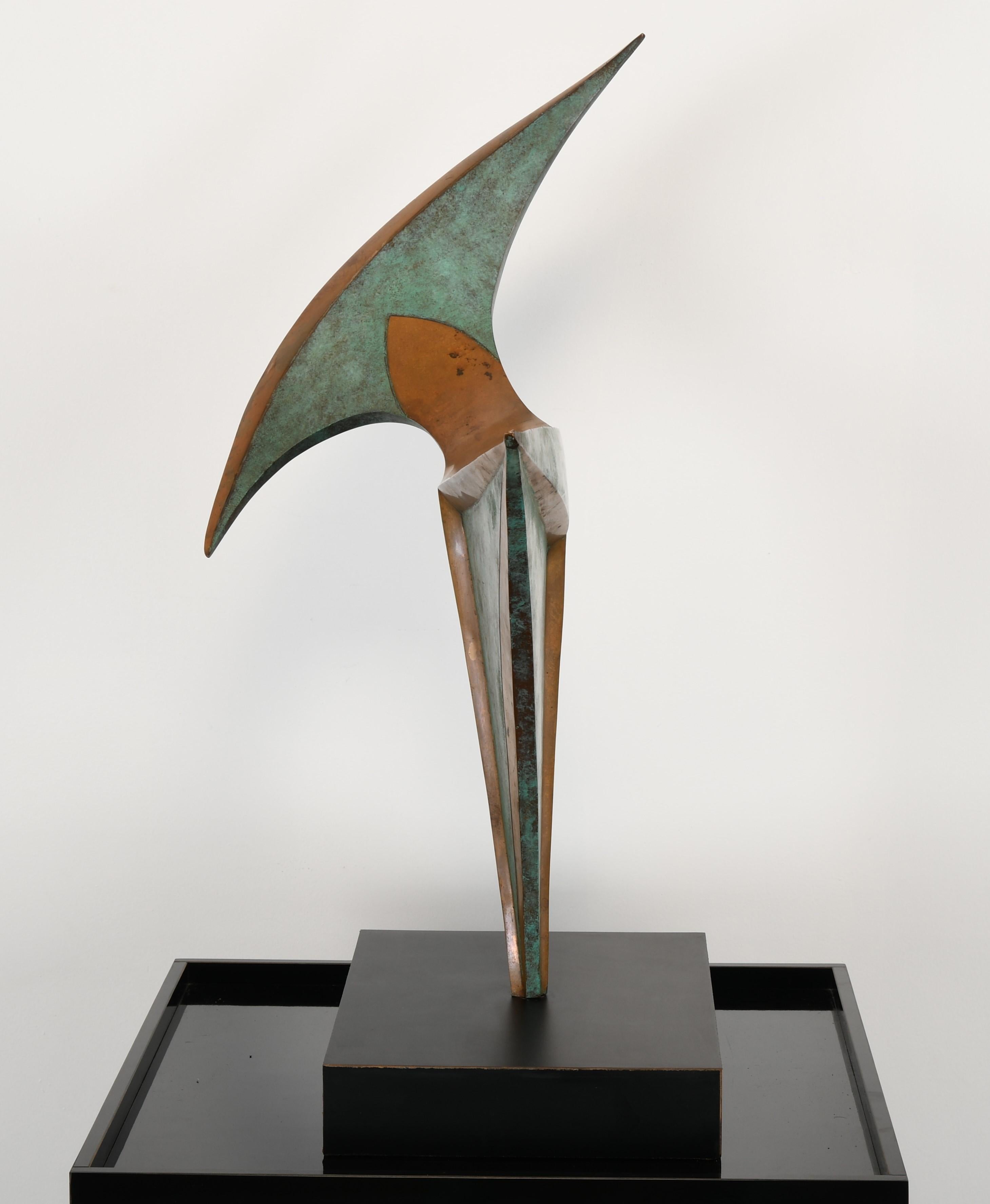 A large modernist bronze sculpture by Michi Raphael, American. Raphael's works are well exhibited and may be found in many private and public collections. This abstract piece is very dramatic with alternating patinated Verdigris bronze and natural