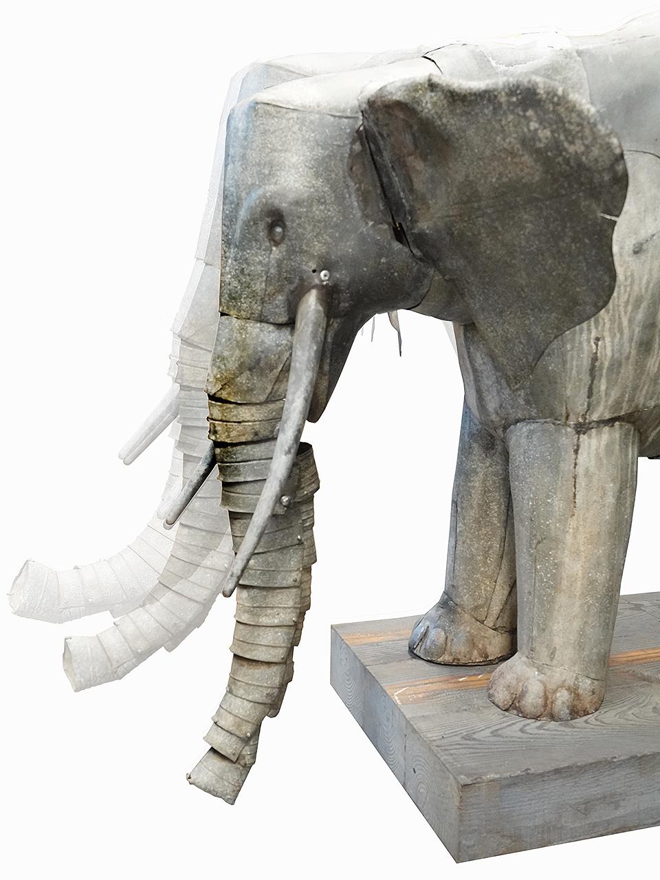 175 years ago this was created as a fountain that worked on water and counter weights. The elephant can now be plugged in and runs on dry land using a motor, cables and gears. The head moves up and down and the trunk curls up looking very life like.