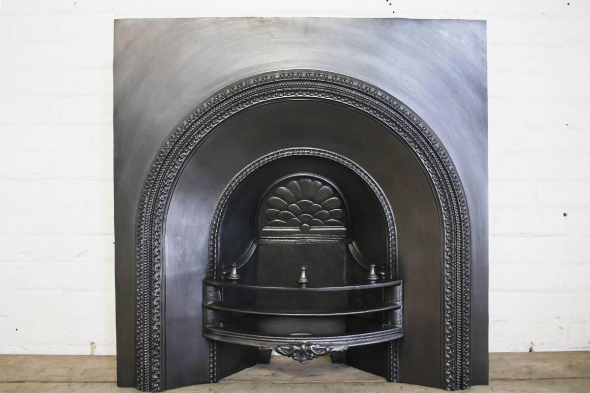 Large mid-19th century cast iron arched fireplace grate, circa 1860. 

Ready to be installed and used for a real coal or log fire or just a decorative item. This grate has been finished the traditional black grate polish, leaving a gun metal /