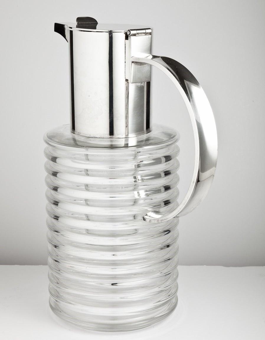 A large mid-20th century Italian glass and silver plated lemonade jug with integral ice container designed by Sergio Asti, Italy, circa 1965.

About the maker;

Sergio Asti is an Italian designer and architect who studied art and architecture in