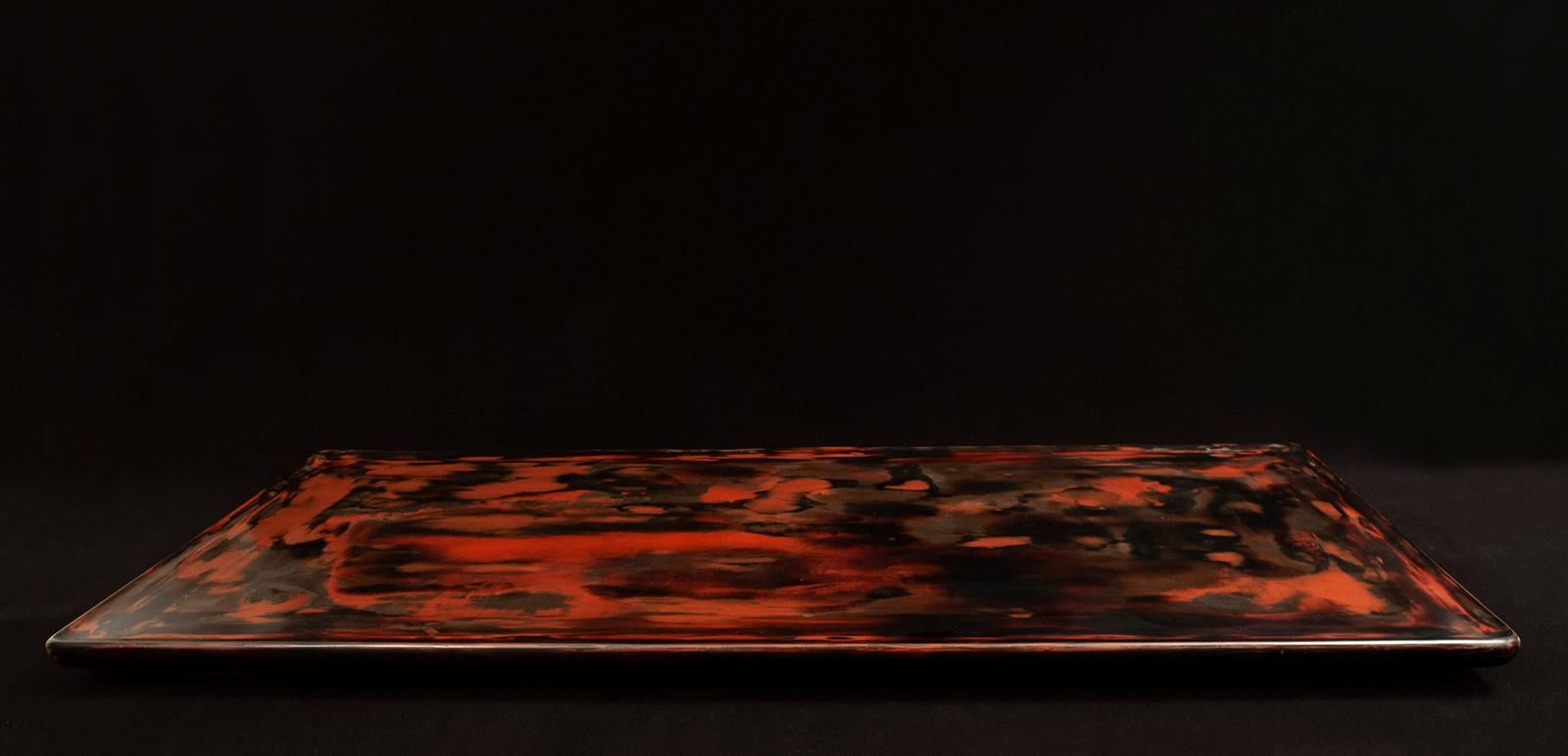 Large lacquer tray, Japan	

A beautiful low wood tray finished with orange and black lacquer. There are some fine surface scratches, and one small lacquer skip, but otherwise in very good condition. 36