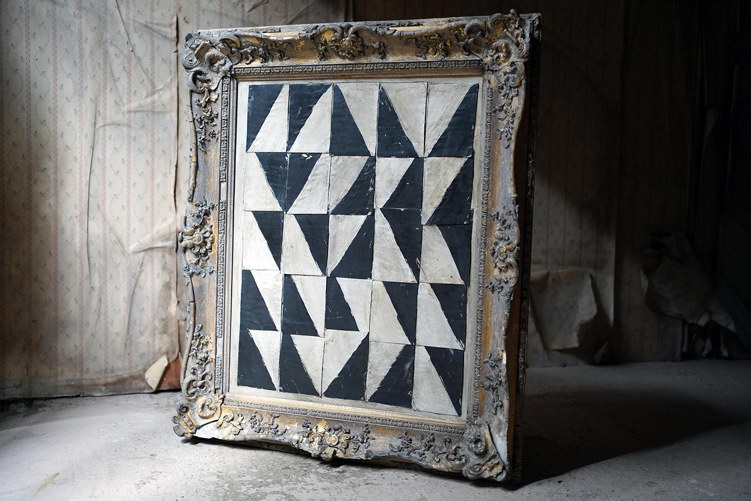 The large abstract geometric painting, hailing from the fifties, painted in the monochrome non-primary colours of grey, white and black, consisting of sections of painted card applied to board and mounted in a good quality English nineteenth century