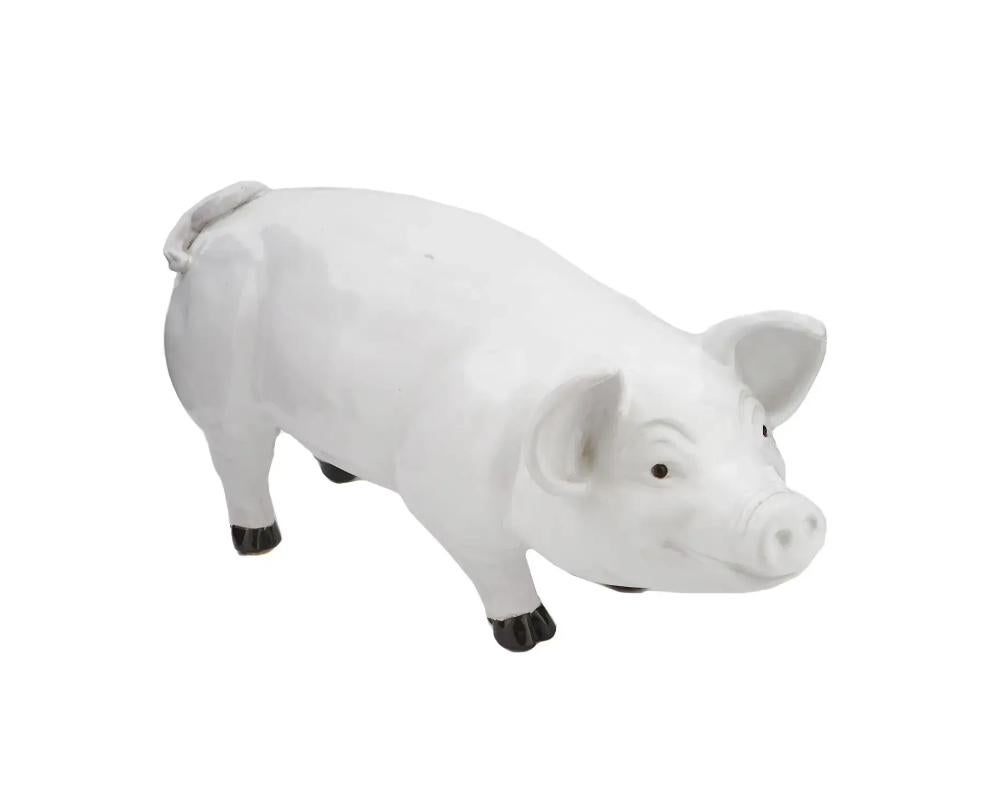 A large-sized Mid-century white glazed ceramic figure representing a naturalistic pig. Finely detailed with glass eyes. France, circa 1940s. Vintage Ceramic And Porcelain Figurines And Statues For Home Decor, Mid Century Animal Figures For