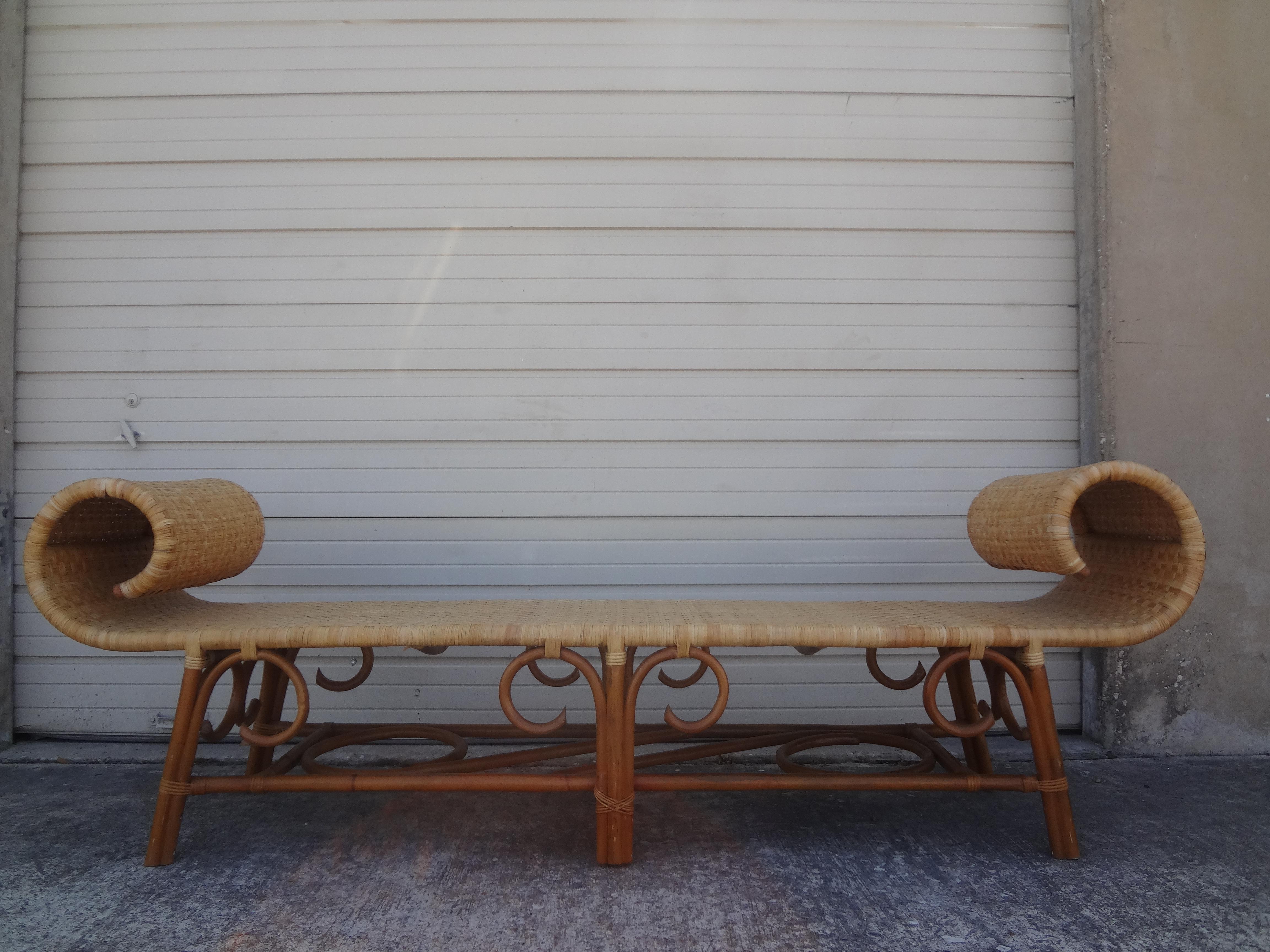 Large midcentury Anglo-Indian style rattan daybed or bench. This gorgeous British Colonial style rattan bench is in excellent condition and was never used. The seat is very tight.
Great at the end of a bed, in a solarium, garden room, morning room
