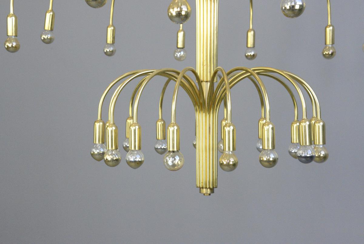 Large midcentury ballroom chandelier

- Curved brass arms
- Takes E14 bulbs
- Comes with chain and ceiling hook
- 2 tiers, 16 bulbs on each tier
- Originally from a hotel ballroom in Hamburg
- German, 1960s
- Measures: 127cm tall x 84cm