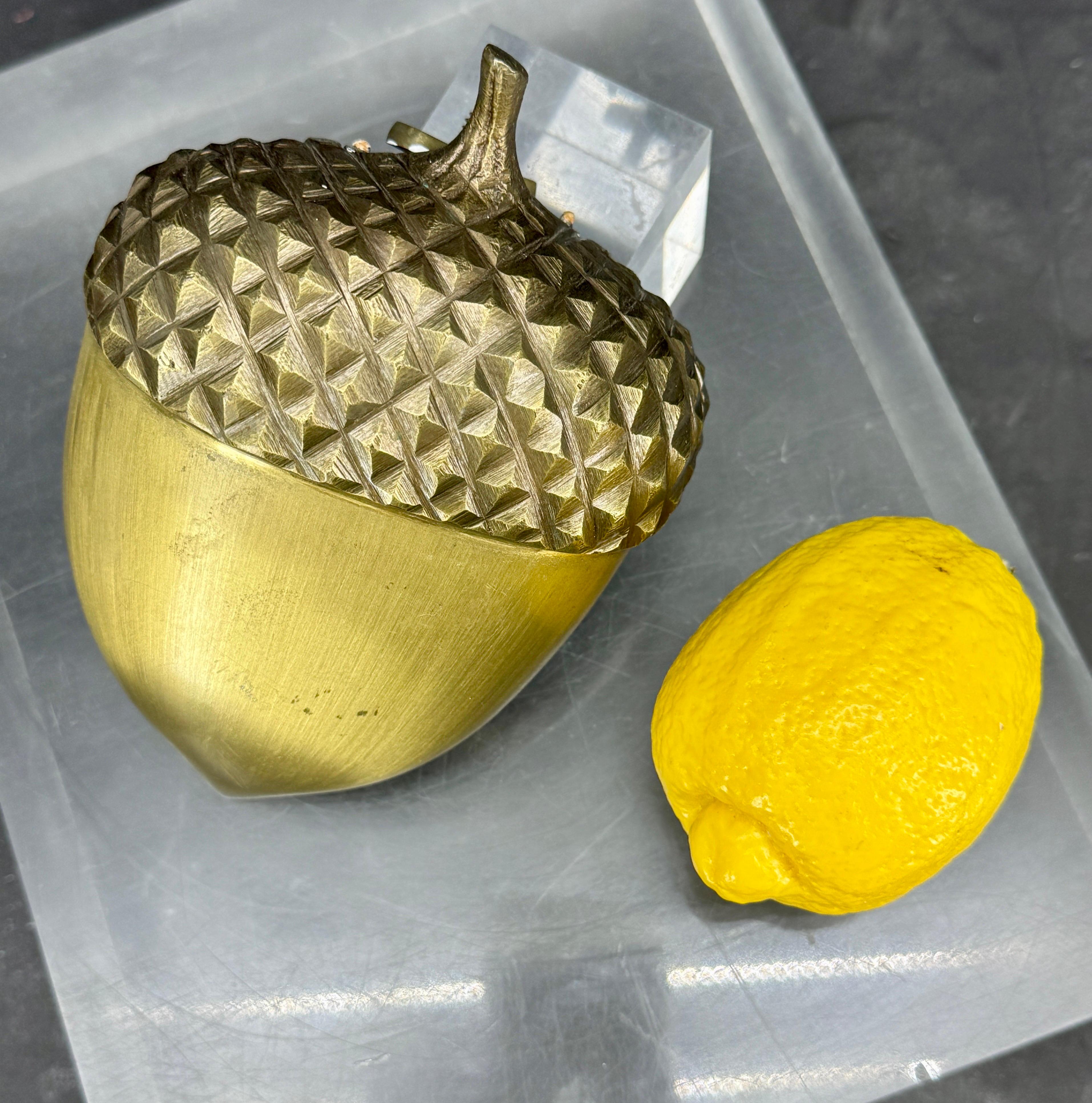 Vintage brass door knocker in the form of an acorn. This sturdy sculpture piece is impressive both in scale and quality of execution. This knocker certainly makes a statement with its classic style as well as original patina. This piece has been
