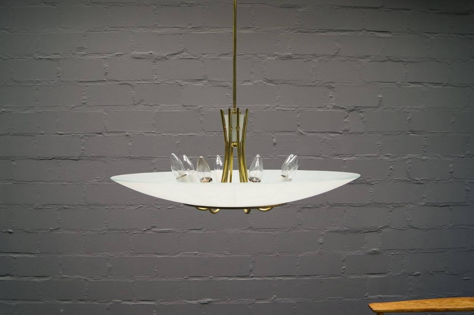 Brass construction fitted with eight E27 sockets and huge glass shade. Made in Italy in the early 1950s.
 