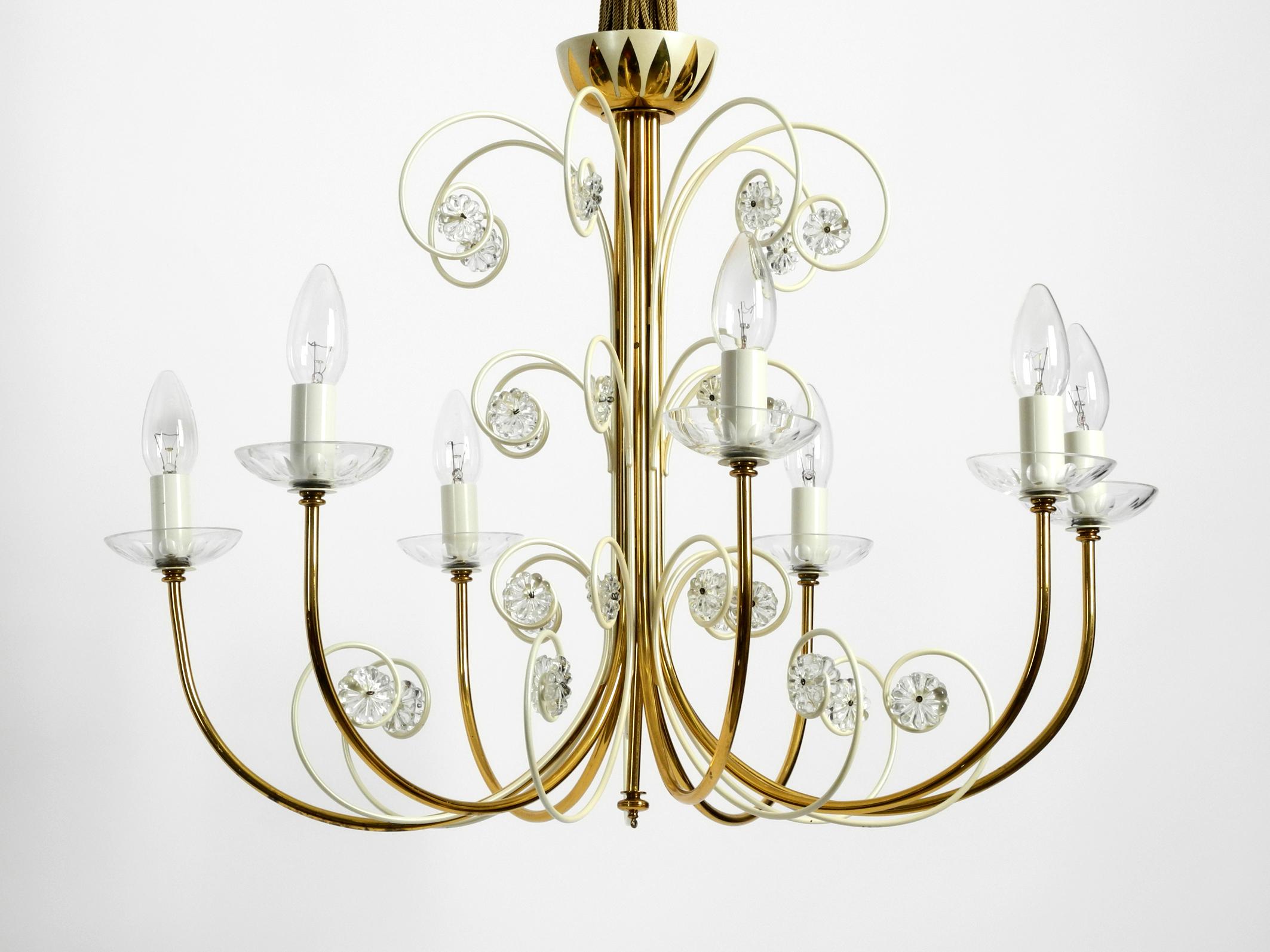 Very rare beautiful midcentury brass chandelier with 7 arms from the Vereinigten Werkstätten. Made in Germany. The lamp is in very good condition with almost no visible signs of wear.
Comes from first hand, has been used very little. Very