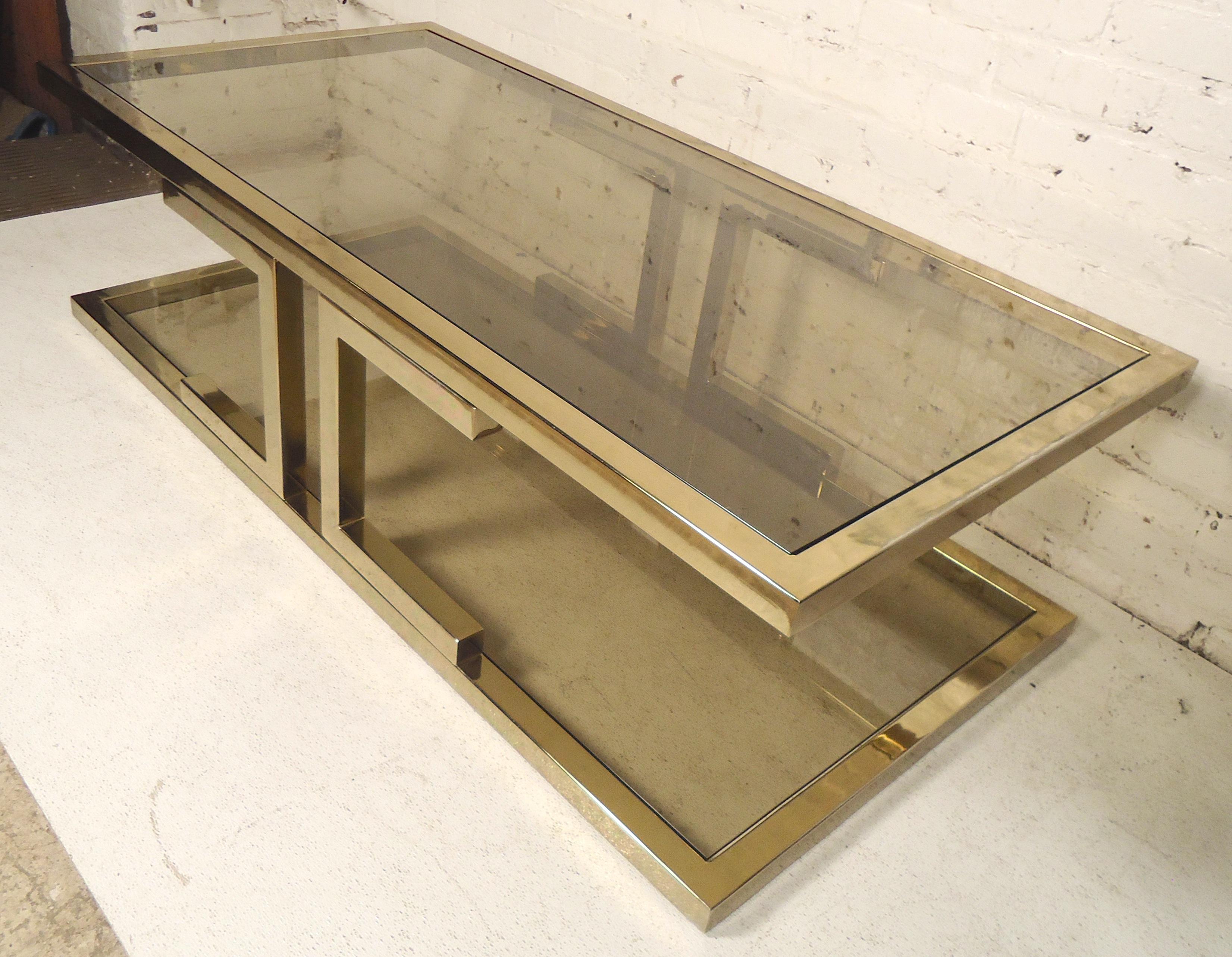 Mid-Century Modern table with Dual glass shelves. Great for large living rooms. Features smoked glass.

(Please confirm item location - NY or NJ - with dealer).
   