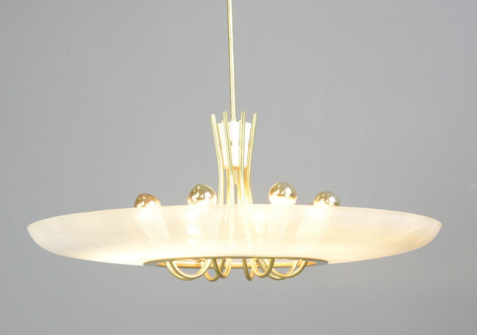 Large midcentury brass and glass chandelier, circa 1960s

- Patterned glass shade
- Brass arms and stem
- Takes 8x E14 fitting bulbs
- German, 1960s
- Measures: 70cm wide x 90cm tall inc ceiling rose

Condition report

Fully re wired with