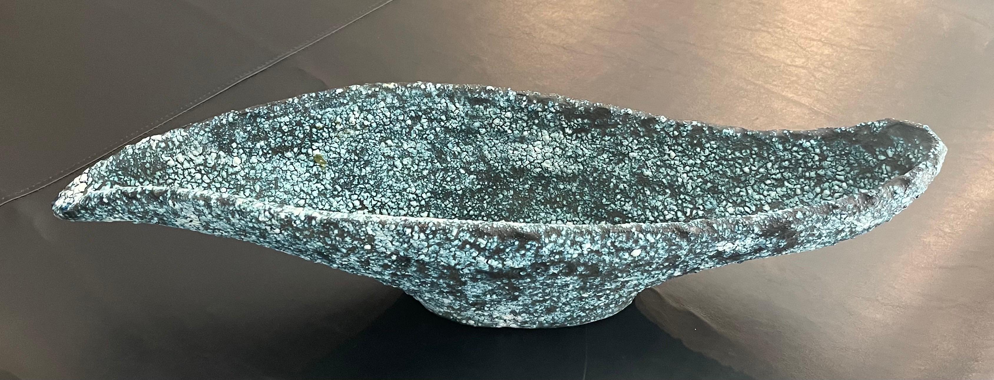 Unique large mid-century Brutalist bowl in blue lava glaze, circa 1970s. The piece is in very good vintage condition with no chips or cracks; it measures 22