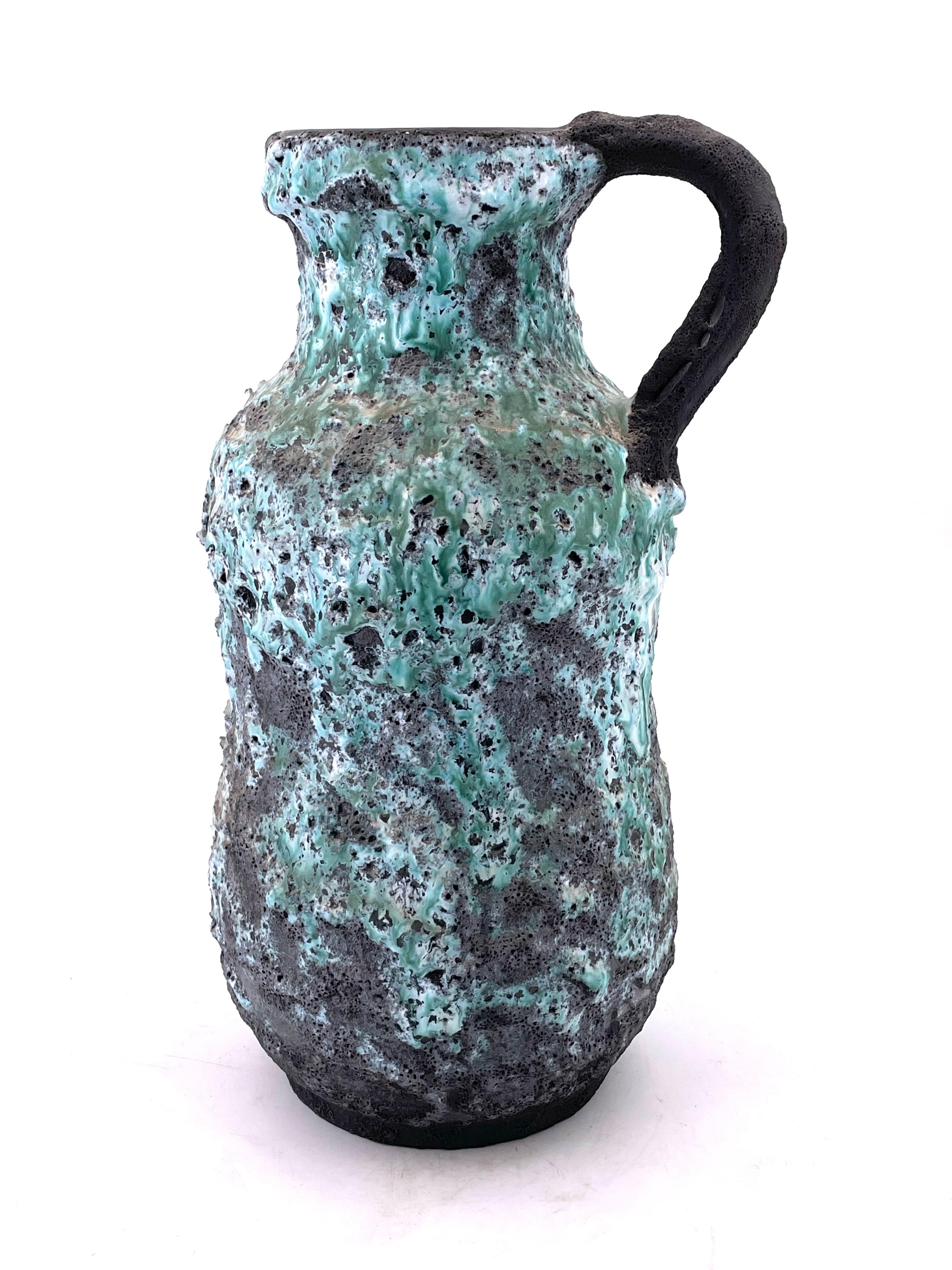A very unique large ceramic pitcher in a Brutalist finish with lava glaze, circa 1970s great condition no chips or cracks.