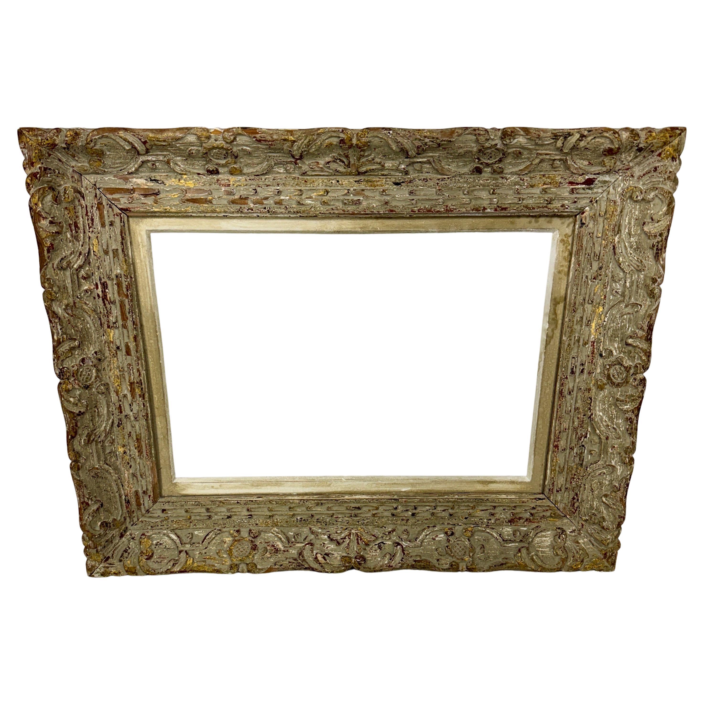 Carved Painted Wood Frame, 1950's

Fantastic carved wood frame with liner, in a distressed finish and incredible patina. Great piece for your favorite oil painting as well as could accommodate glass for a mirror. Certainly has the European/French