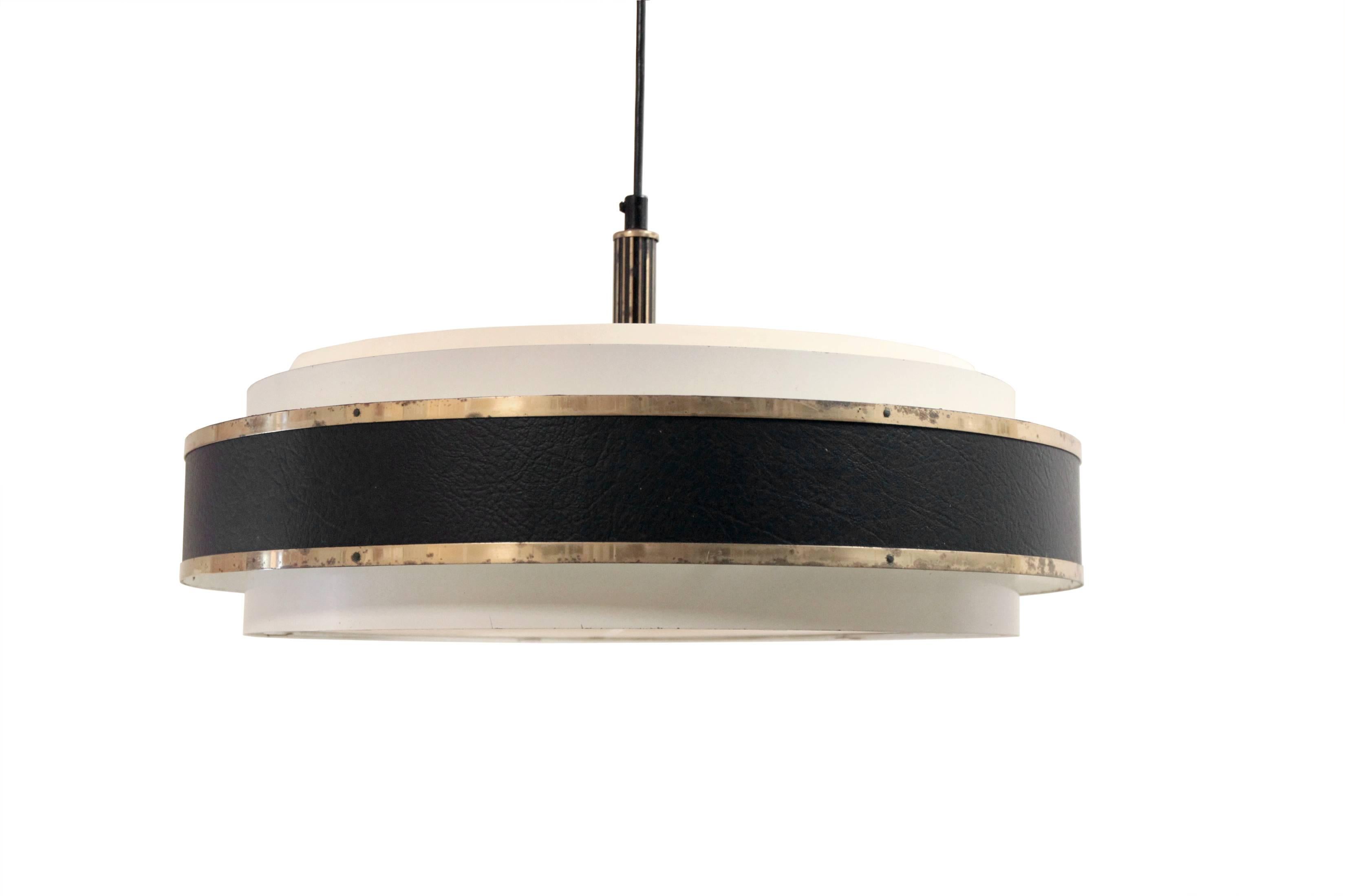 Wonderful and decorative ceiling lamp in painted steel, leather, brass and plastic. Designed and made in Finland from circa 1960s second half. The lamp is in a very good vintage condition and is fully working. There are three lamp sockets taking 75W