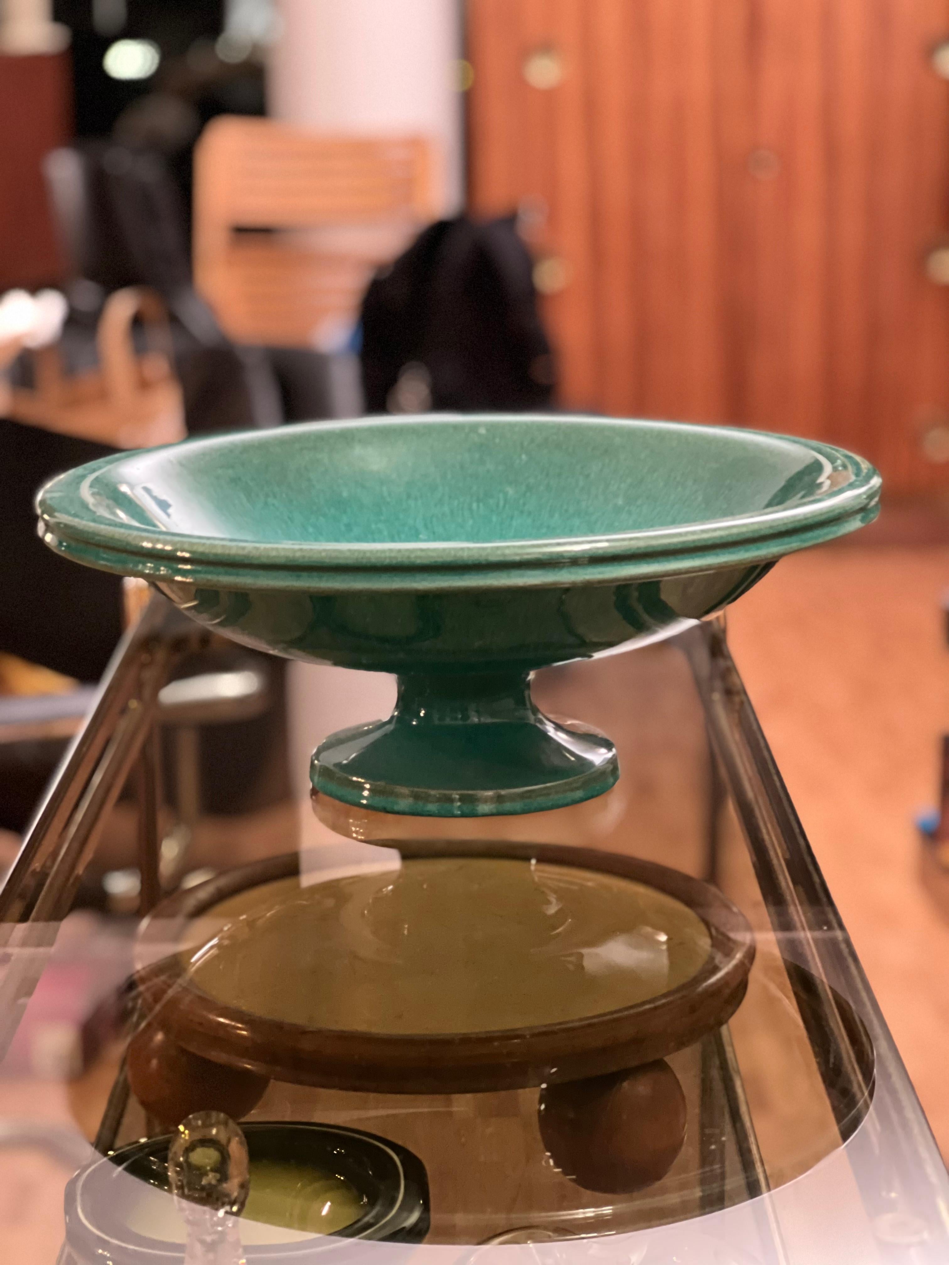 Amazing dark green glazed Majolica European Mid-Century centrepiece. Beautifully formed bowl, uplifted on a classic shaped base. Would look lovely on any table.