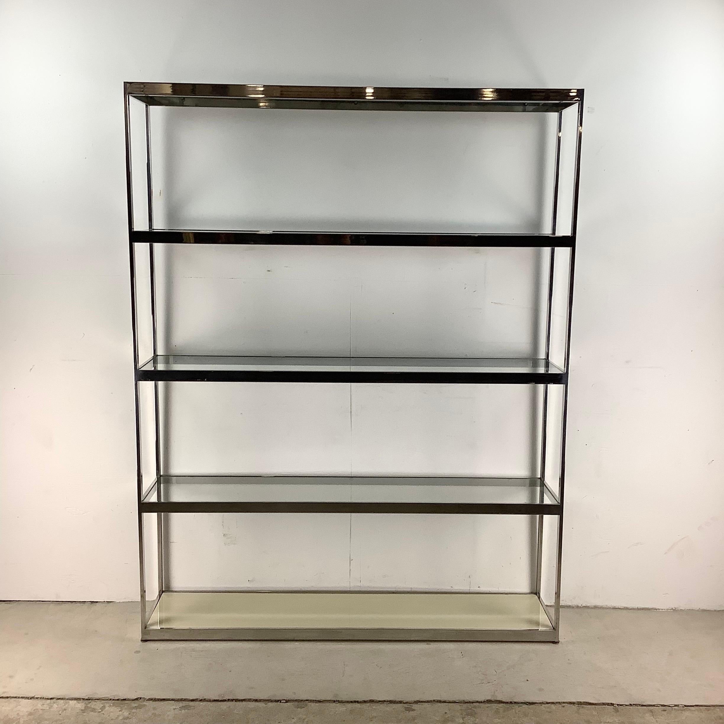 This large scale mid-century chrome etagere features five wide shelves perfect for showroom or home display. Elegant modern simplicity makes this Milo Baughman style etagere shelf an impressive addition to any interior, whether against the wall or