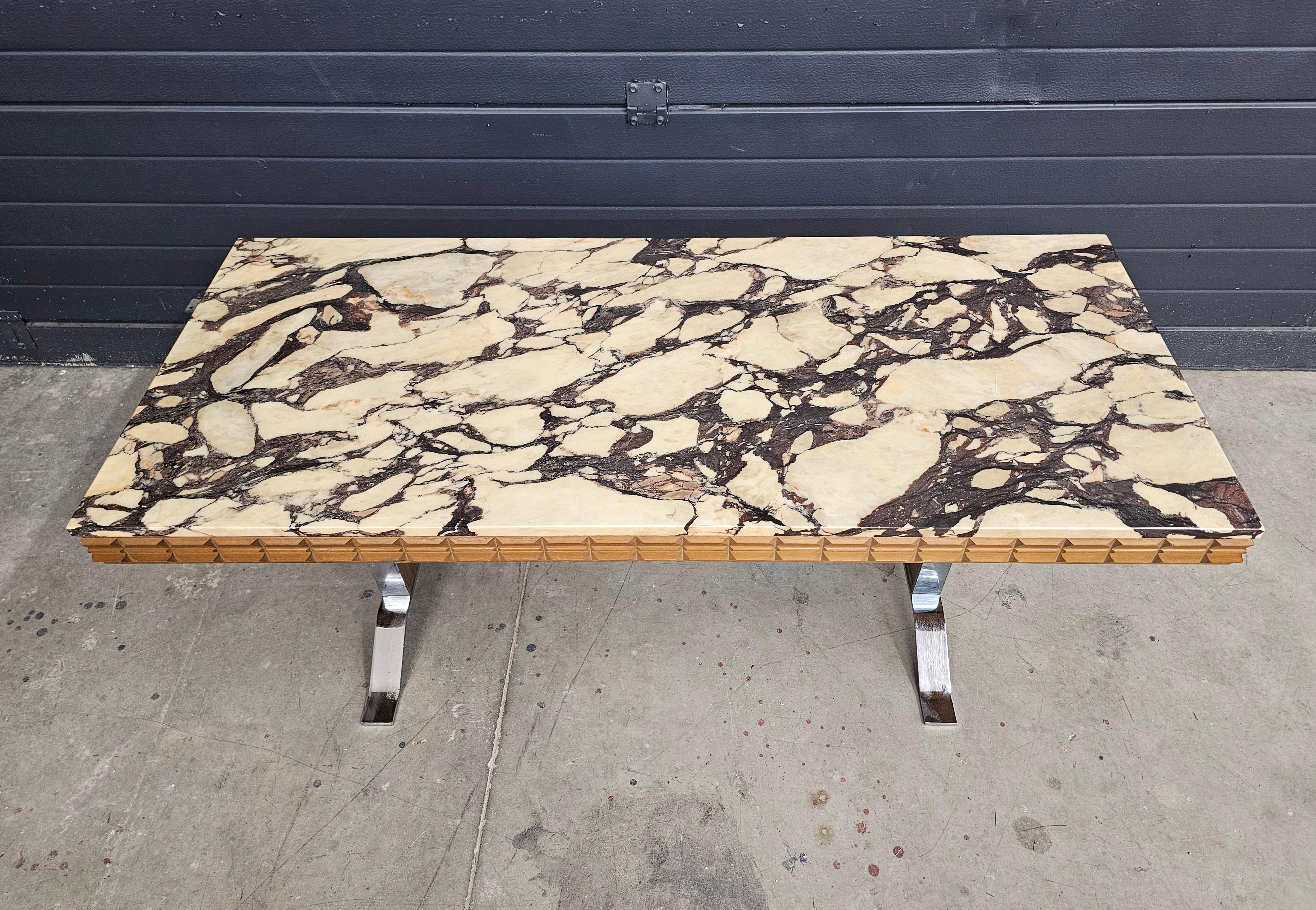 In this listing you will find a large Mid Century Modern coffee table done in chrome and teak, with the marble top. The marble in question is Calacatta Viola, one of the most luxurious marbles in furniture production. Due to its age, the marble have