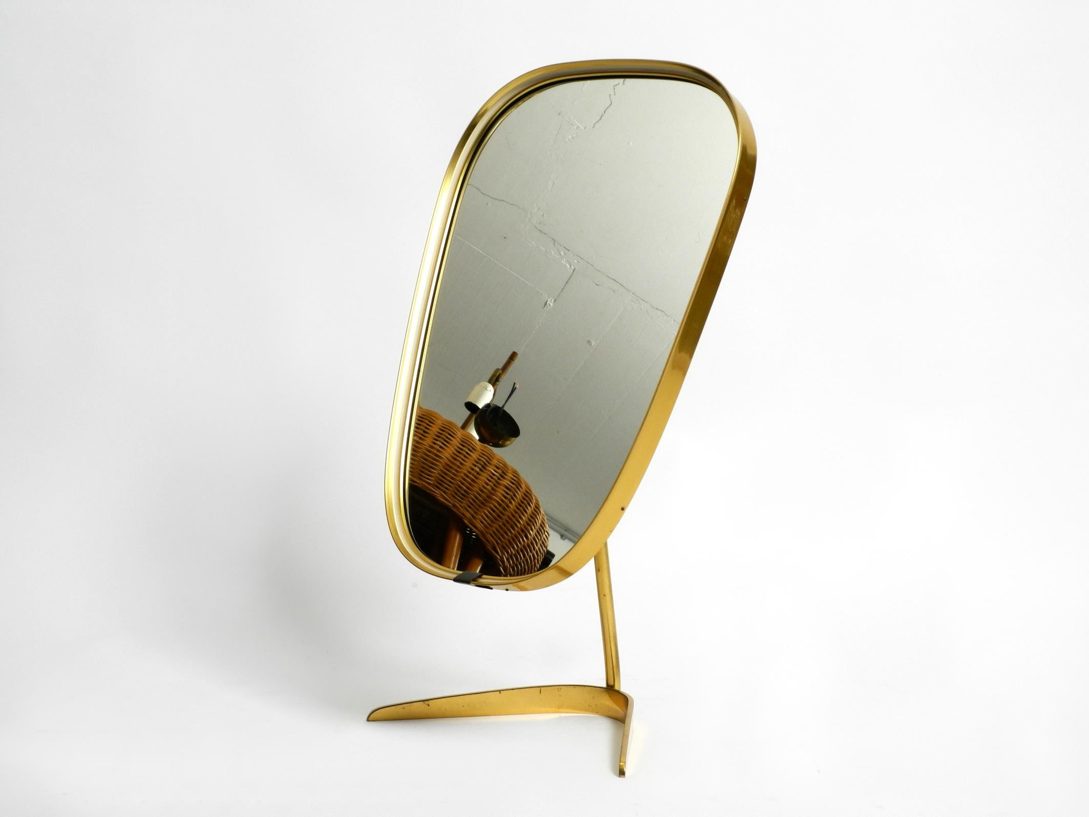 Beautiful large Mid Century crow's foot table mirror.
Manufacturer is 