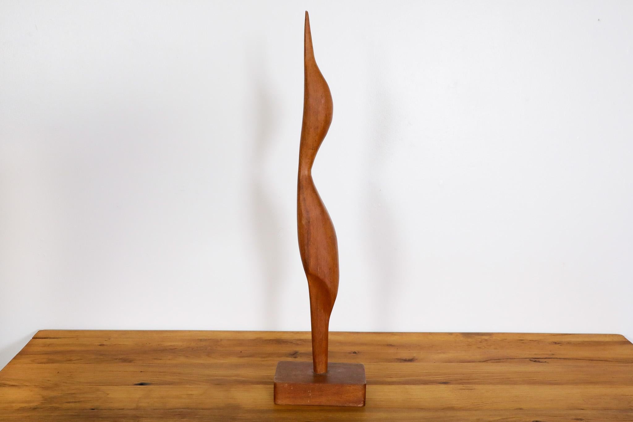 Mid-Century, Jacob Hermann style, tall Danish teak stork sculpture. Very handsomely carved, a beautiful table or shelf accessory. In impressive original condition with some light age appropriate wear consistent with its age. 