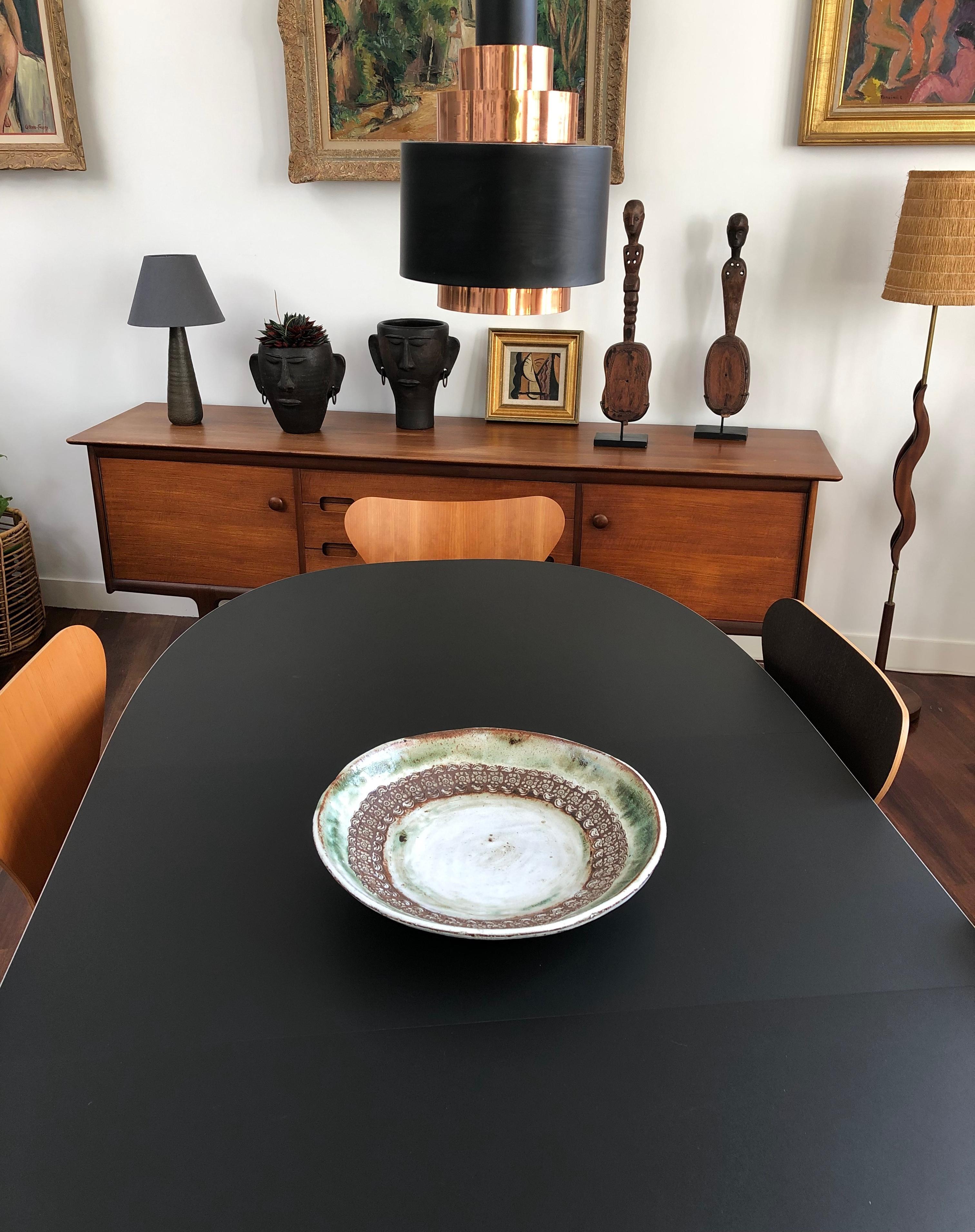 Large midcentury decorative platter (circa 1960s) by Albert Thiry (1932-2009). A whitened glazed centre is encircled by deeply engraved flower motif in brown and topped in the upper most circle in Thiry's trademark hazy green. Rustically beautiful,