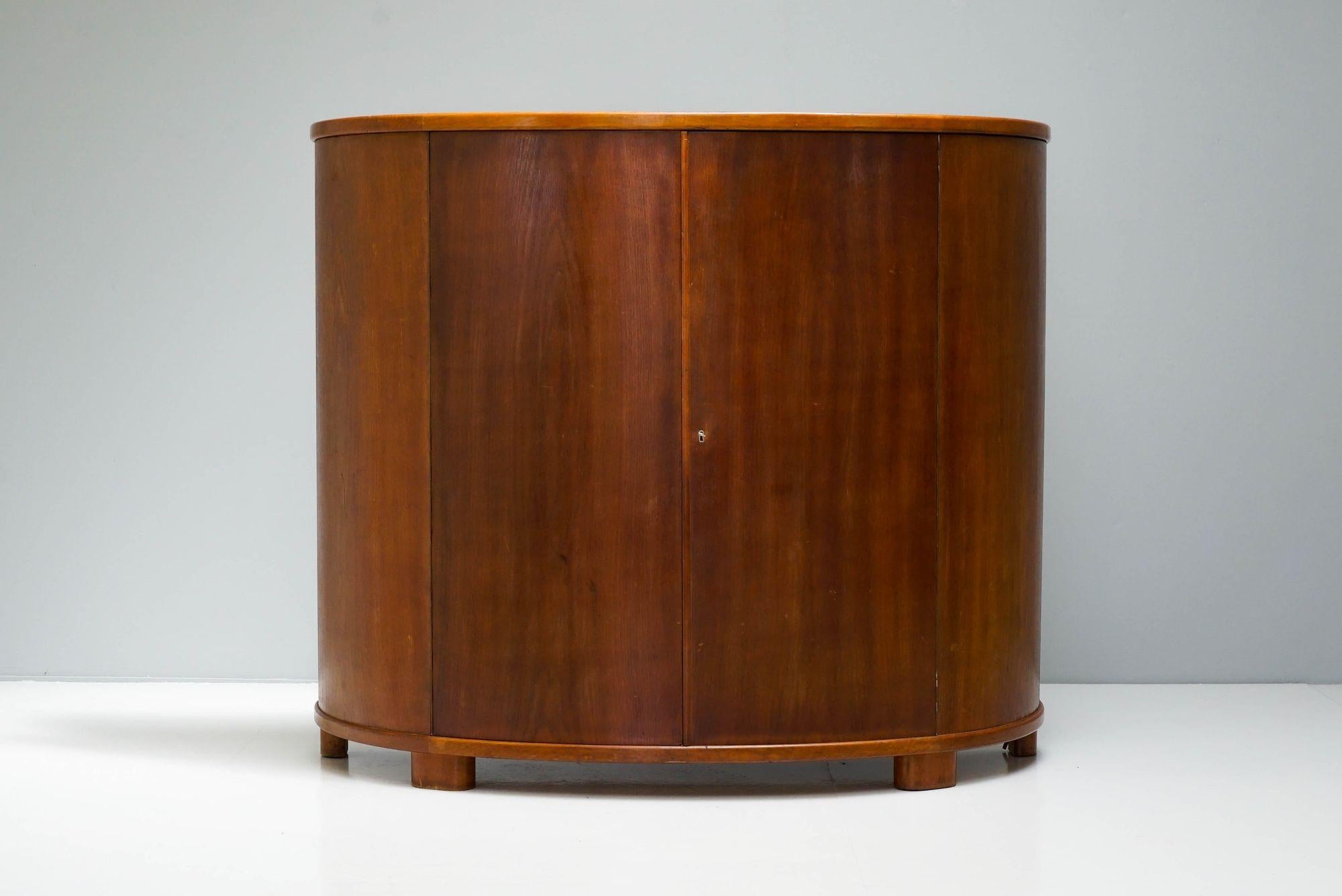 Mid-Century Danish Demi-lune drinks cabinet. Teak exterior and birched lined interior. Fantastic quality with ample storage.

H 130cm x W 152cm x D 56cm