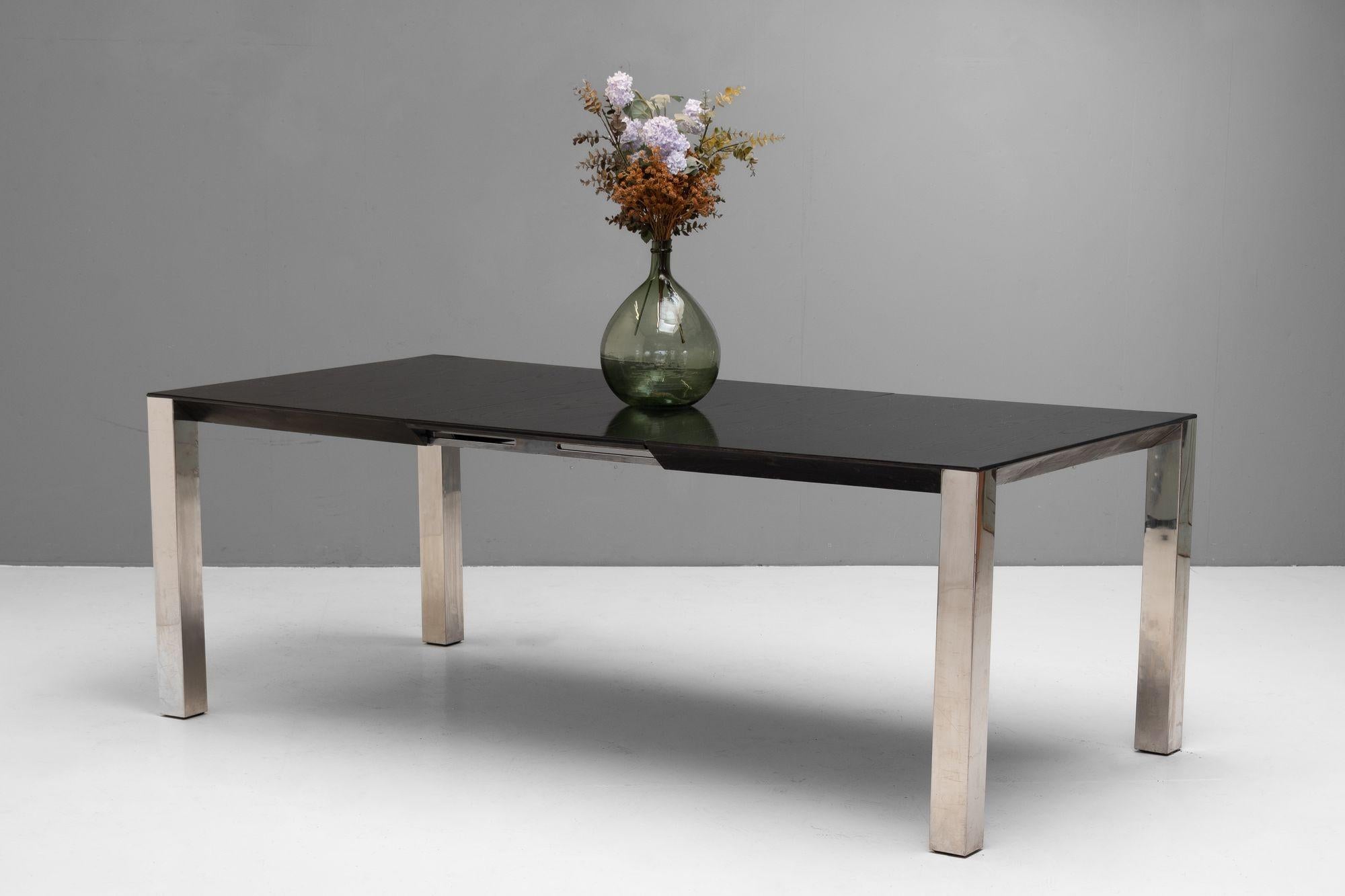 Large mid-century extending dining table with chromed legs and ebonised top.
Italy circa 1960.
H 70cm (AH 65cm) x W 140cm/197cm x D 100cm
Please be in touch for an accurate shipping quote.