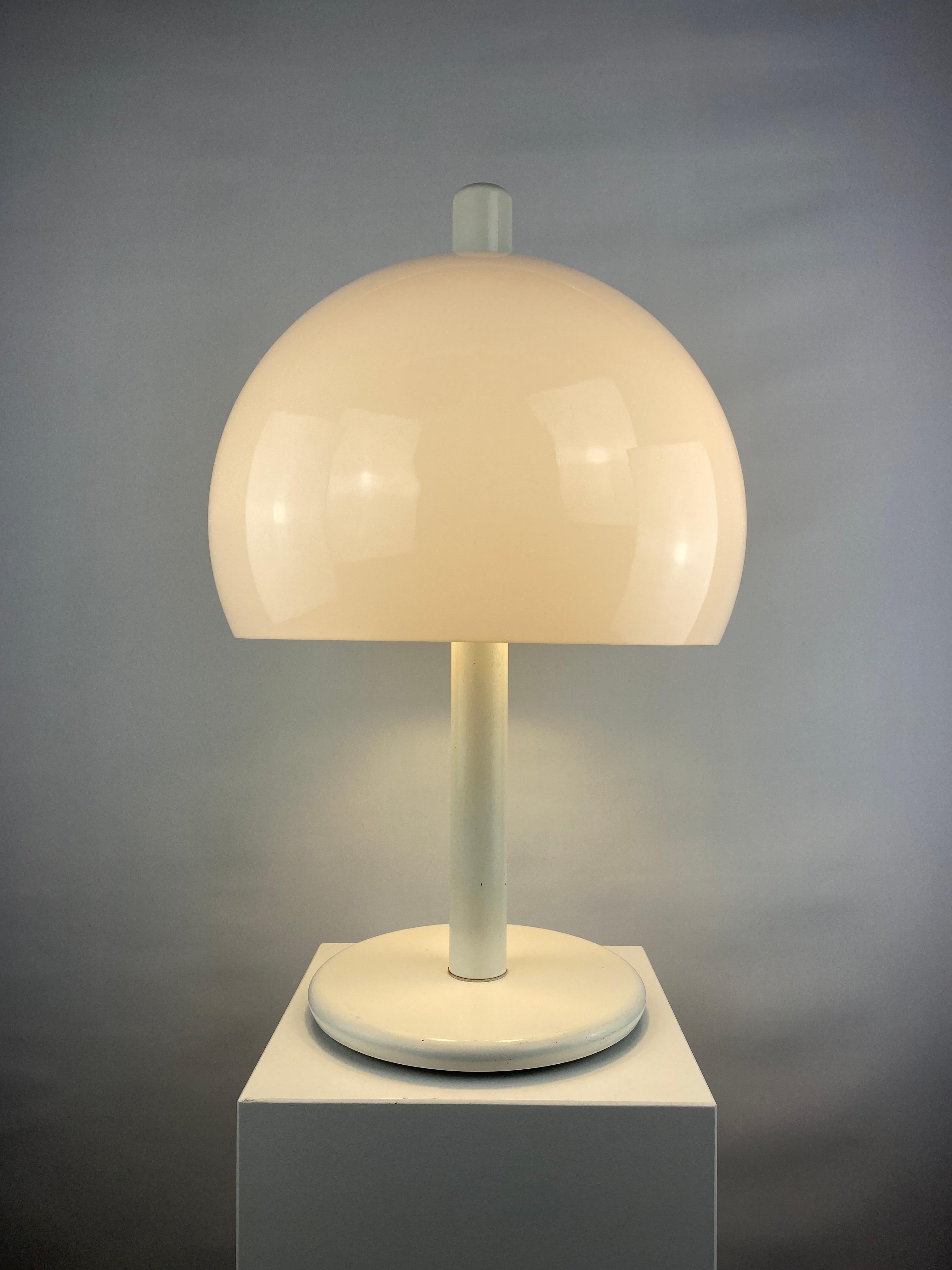 Very funky and very large mid-century mushroom shaped table light with an acrylic white shade and white metal base. This lamp is manufactured in The Netherlands and is from the 1970's.

Could be made by Dijkstra, Anvia or Herda but I cannot tell for