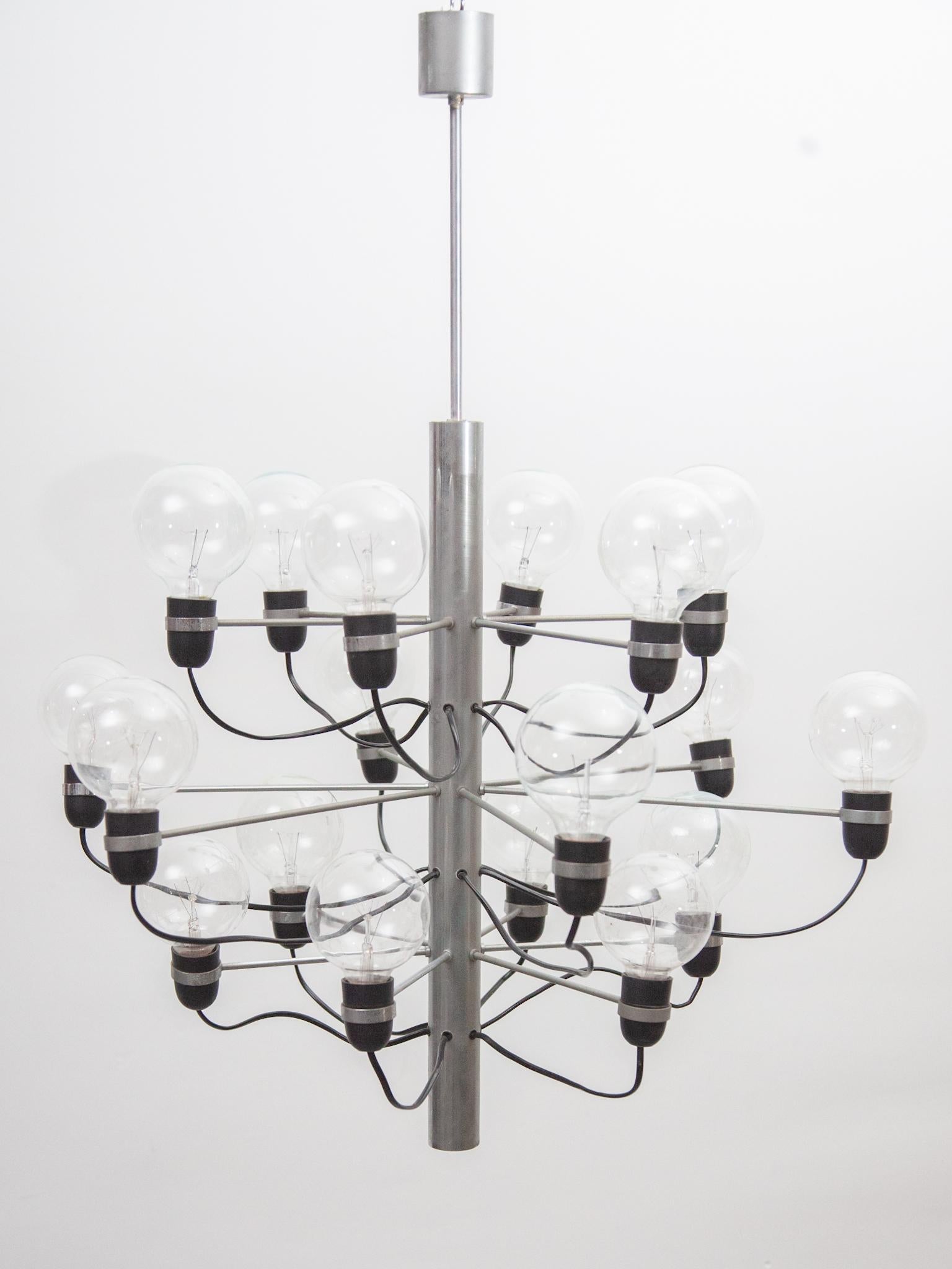 The chrome chandelier designed by Gino Sarfatti for Flos 1980s. This design contains 18 bulbs and has a chrome base and bakelite holders. The chandelier contains in good original condition.