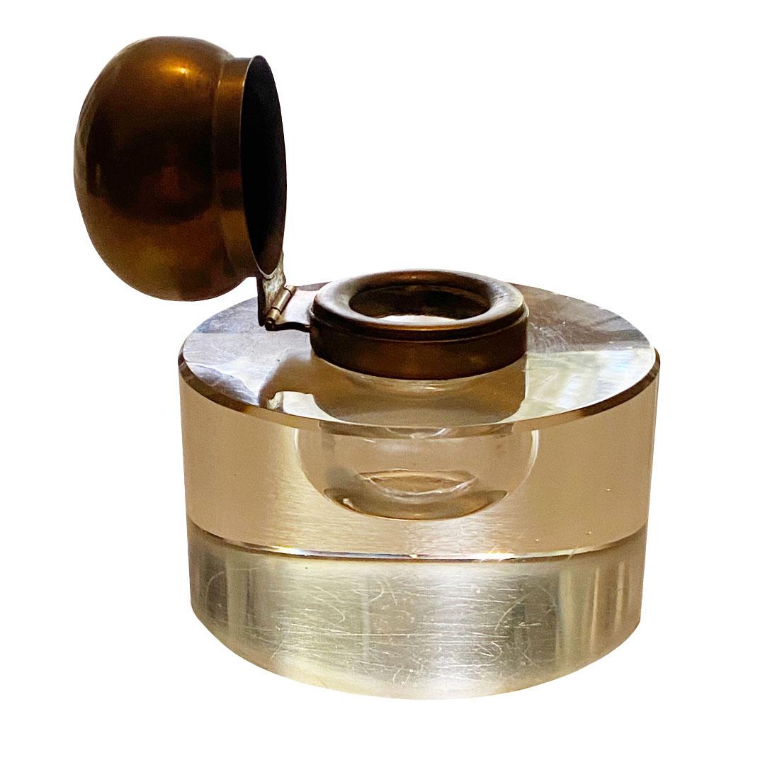 A mid century glass inkwell with a hinged brass top. A very stylish design that displays beautifully.
