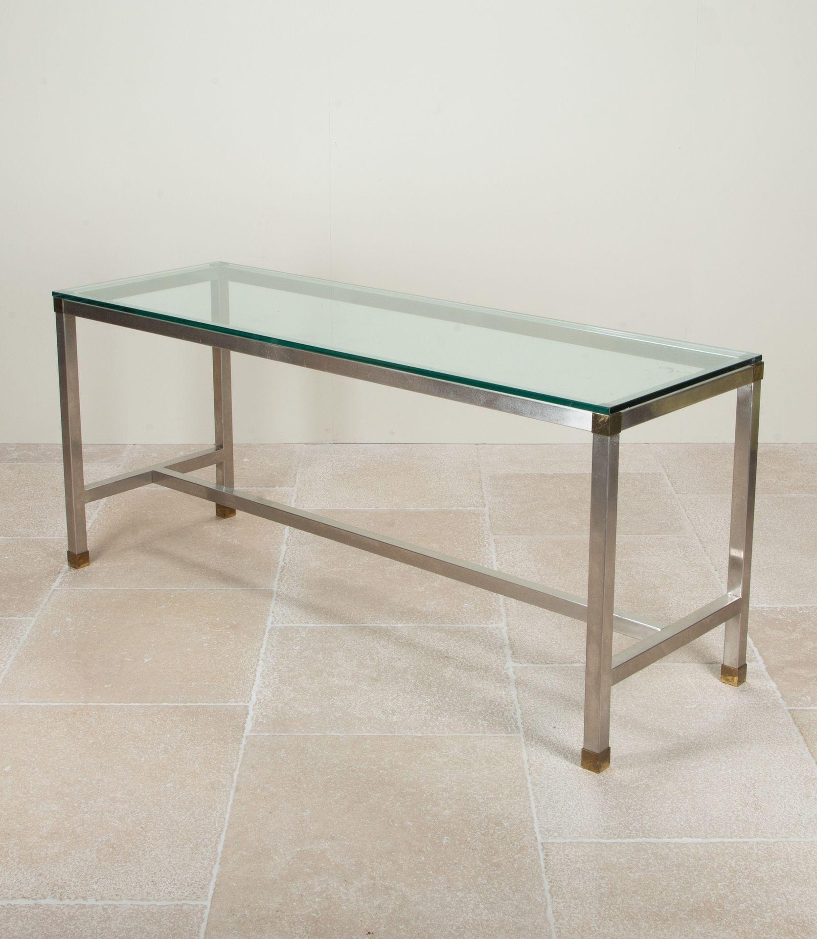 Large Mid-Century English steel, brass and glass console table by David Hicks. Circa 1970.

Literature: A. Bony, Meubles et décors des années 70, les éditions du regard, Paris, 2005, p. 184 for a similar model. P. Favardin, Les décorateurs des