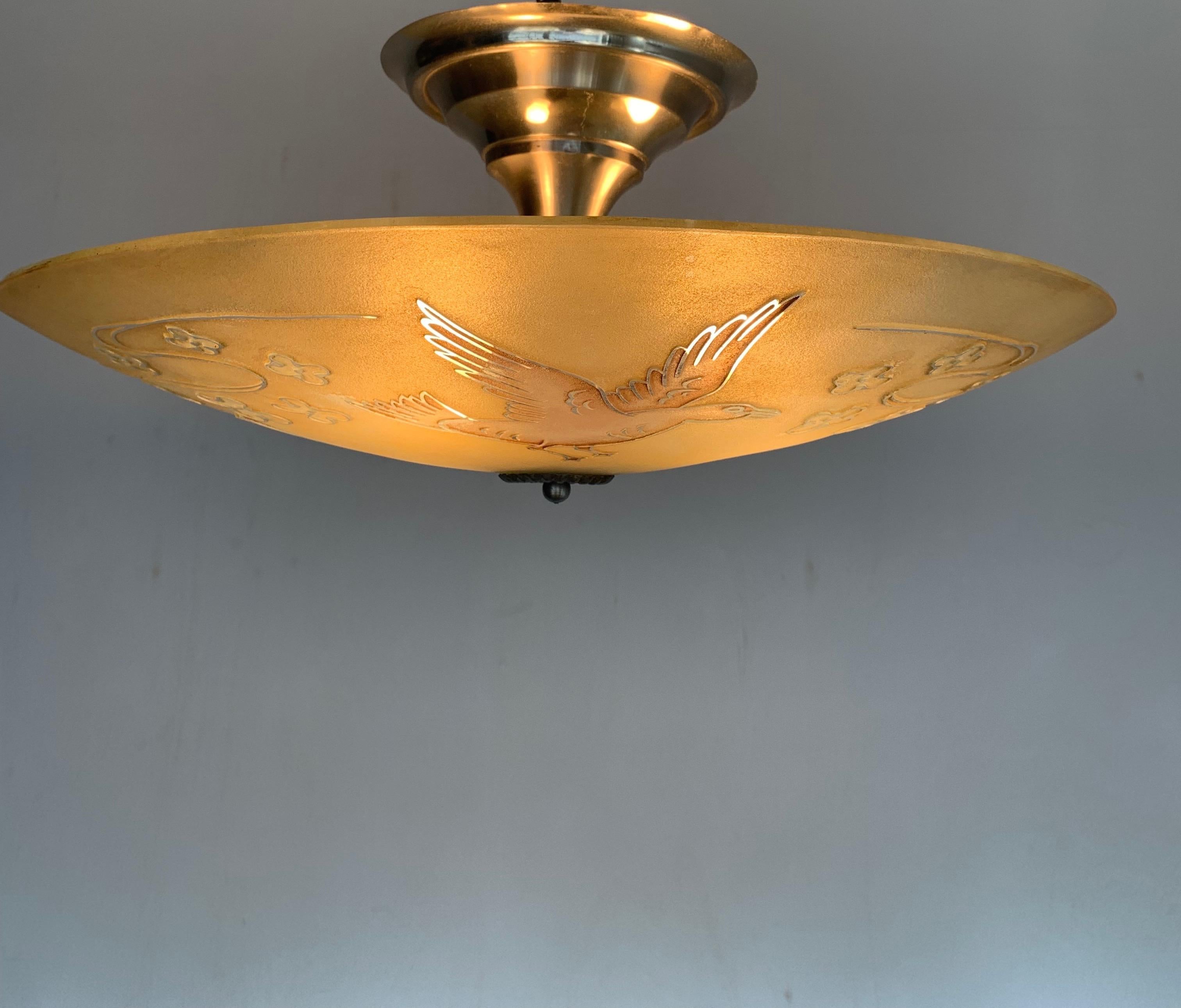 Impressive art glass pendant light with dove sculptures in relief.

This 1950s light fixture is another great example of the workmanship that you no longer see in modern society. Fortunately former owners took really good care of this delightful and
