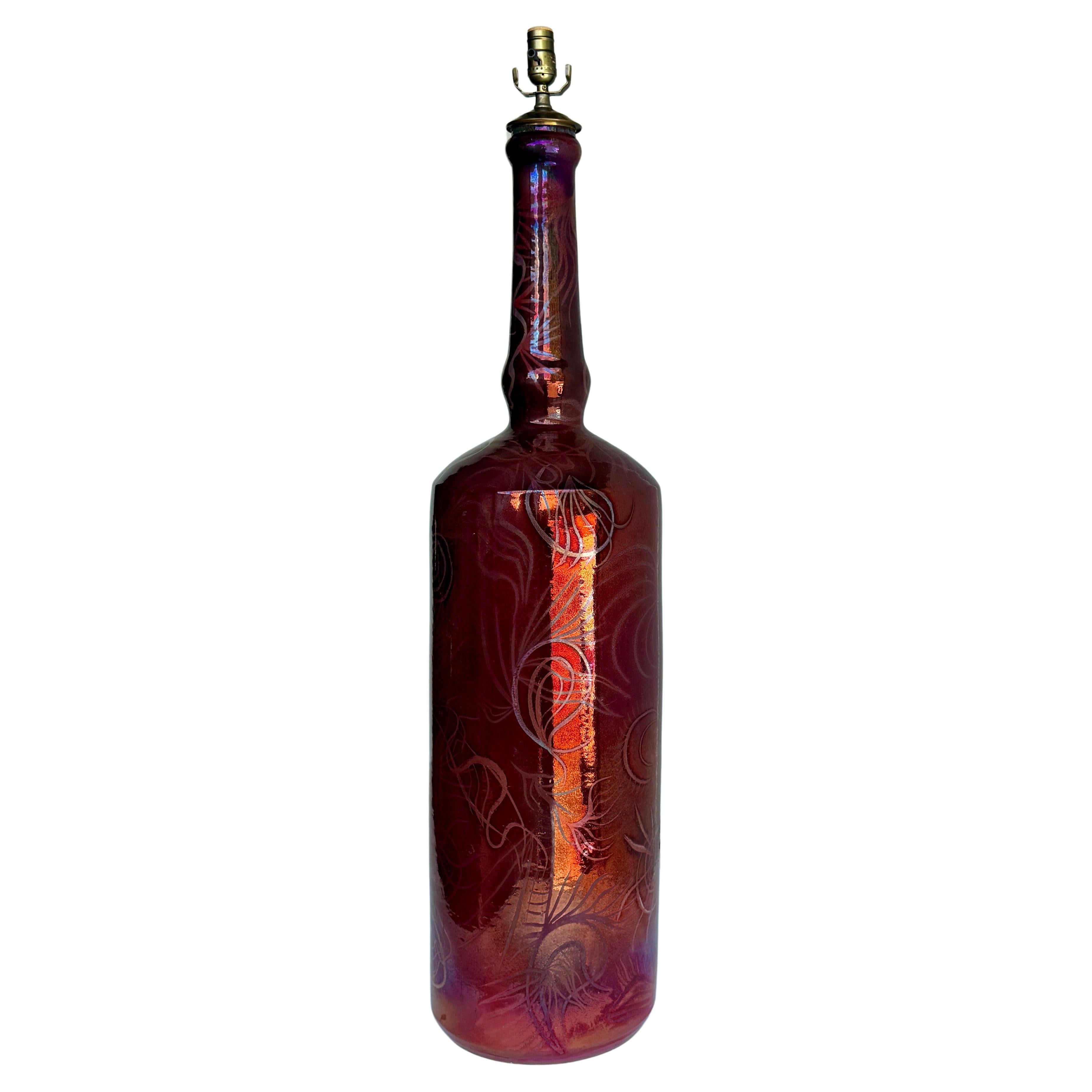 Oversized MCM Colored Glazed Bottle Floor Lamp, 1960’s

Very impressive MCM Lamp with lots of character. This oversized floor lamp has exquisite details including etched drawings within the glass. Every angle of this lamp reveals a different unique