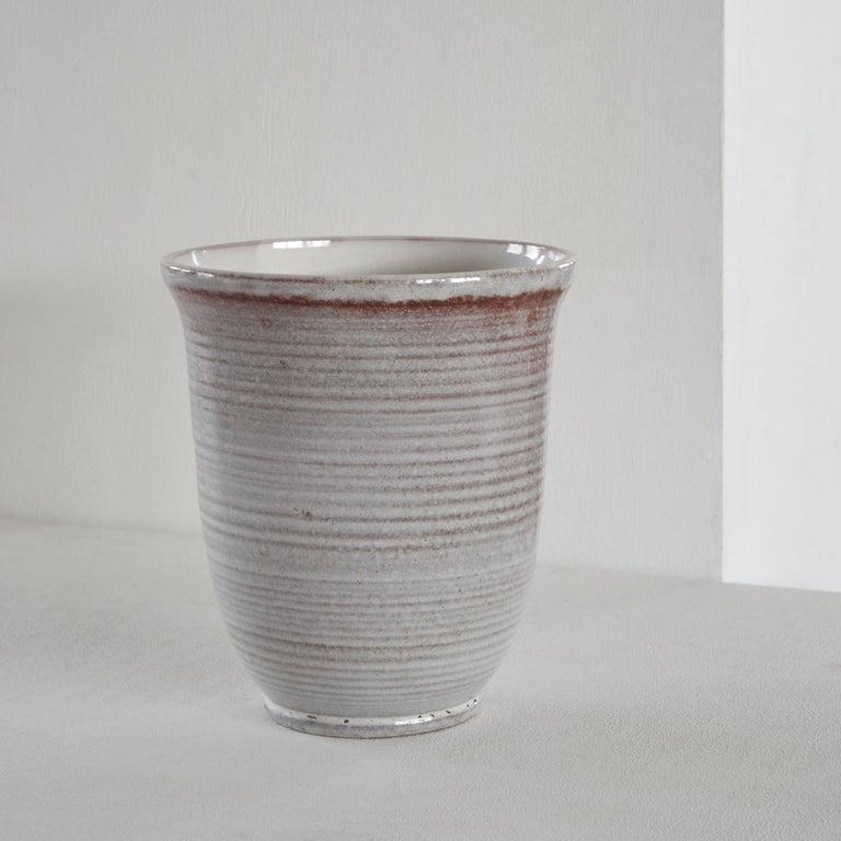 Large sized mid-century vase, The Netherlands, 1950s.    This elegant cone shaped vase is timeless in design and decor. Thick glazed in beautiful tones of grey and stone red. The large size makes it a stand out piece in your interior.     Great