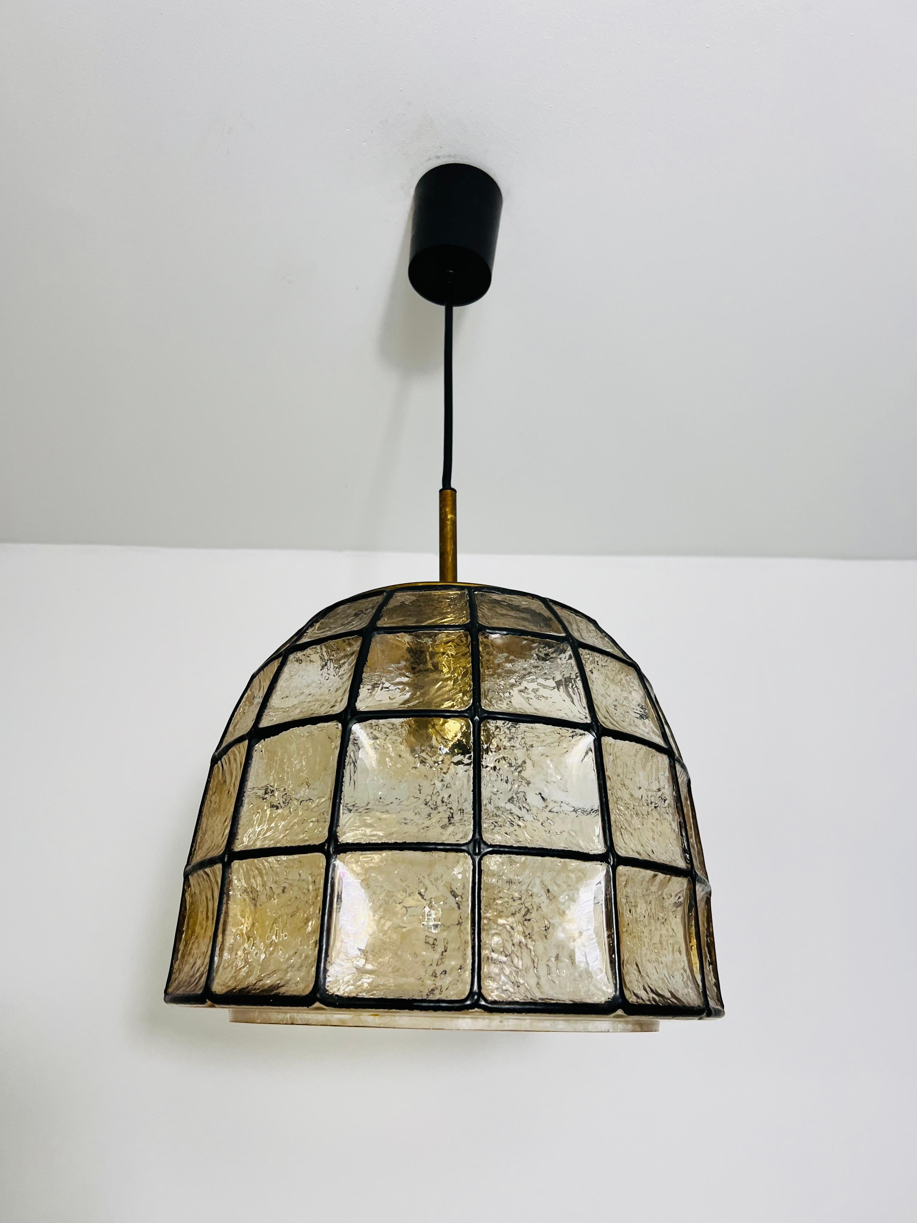 This exceptional ceiling lamp by Glashütte Limburg, crafted in the 1960s, stands out with its rare, oversized diameter, making it a unique collector’s piece. Most lamps of this type are smaller, but this rare example offers an impressive presence,