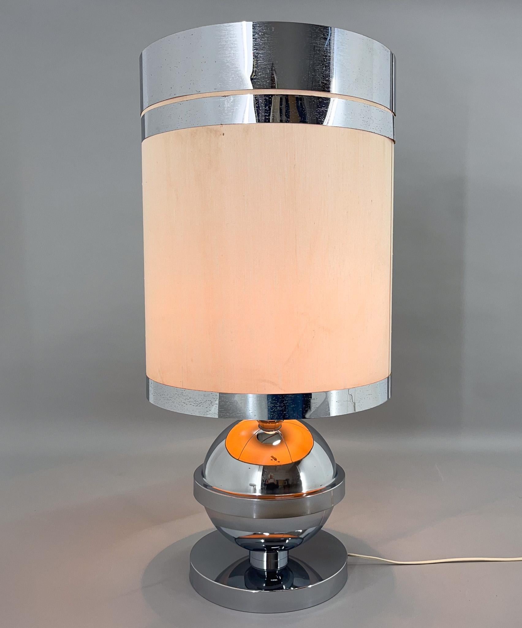 Large vintage table lamp made of chromed metal base and fabric lamp shade with thin chrome plated rim. Produced in Italy in the 1970's.US plug adapter included.