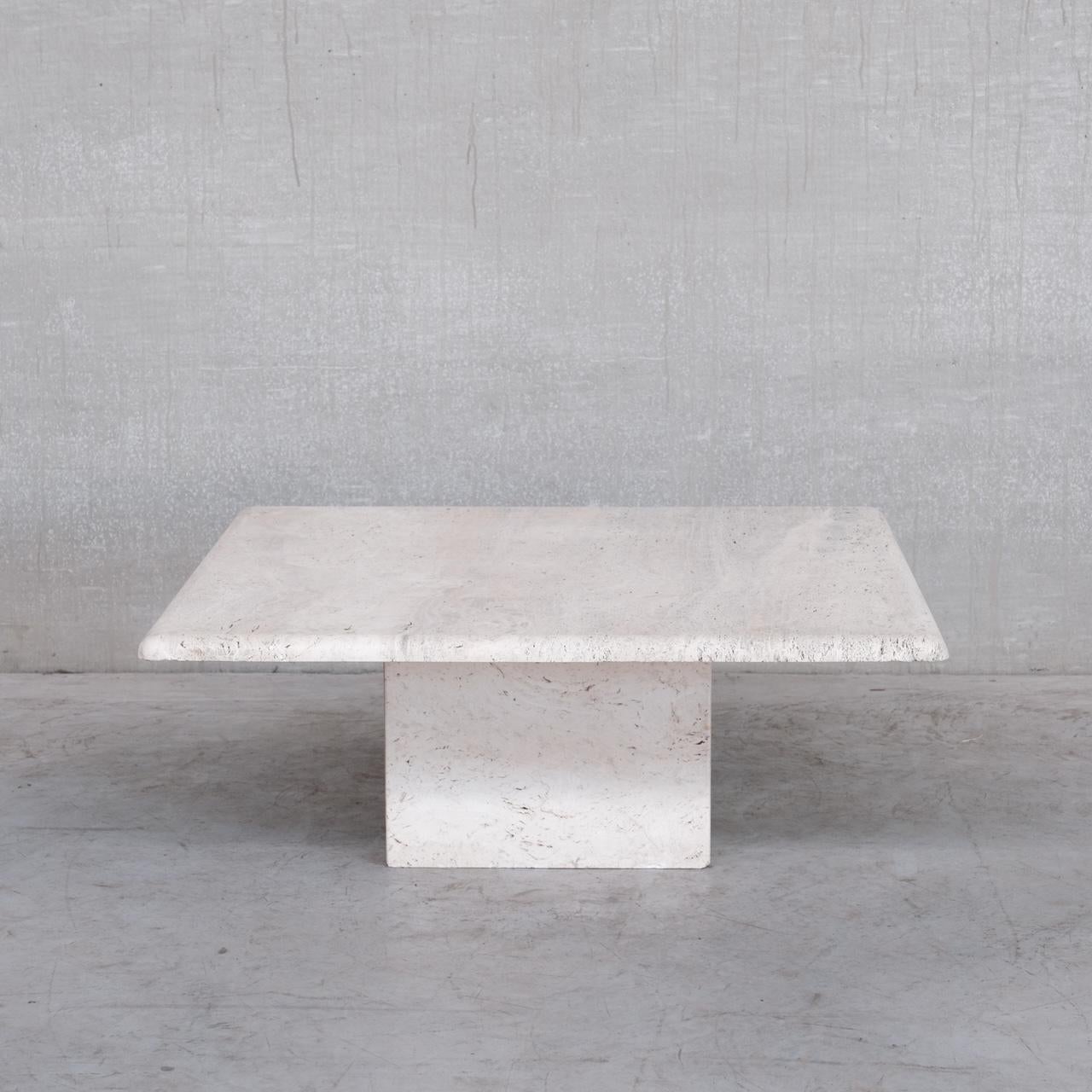 A large open travertine table. 

Italy, c1970s. 

Possibly by Up&Up as it is very good quality. 

The travertine is not polished or varnished so has that lovely natural muted colour. 

Some occasional nicks but generally very good condition.