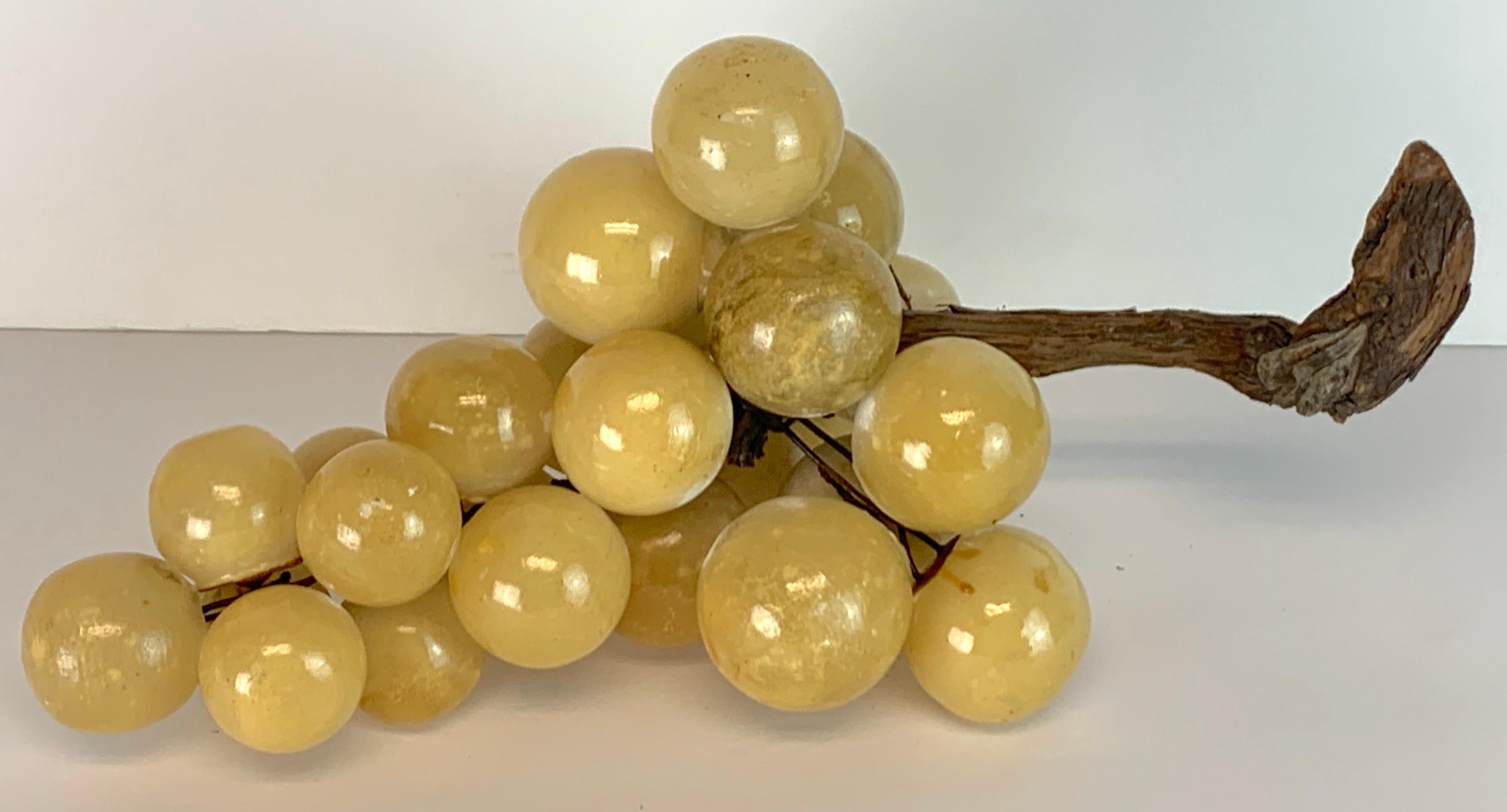 Large midcentury Italian marble grapes sculpture, realistically modeled with carved wood grape stem.