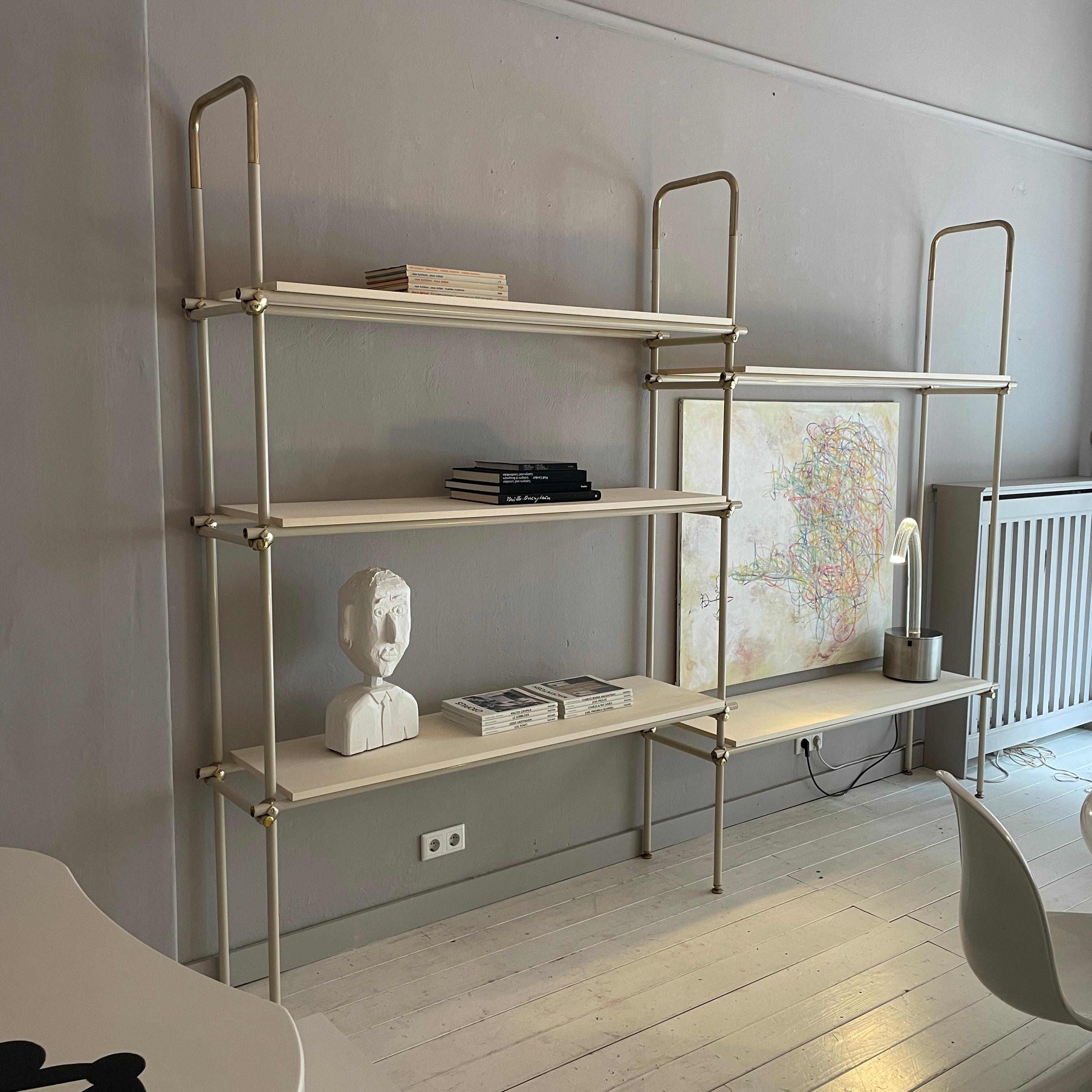 This beautiful Large Mid-Century Italian Metal and Brass Shelf / Shelving System, was made around 1970.
The base is made out of an off white lacquered metal and brass. the shelf boards are veneered in maple.
A unique piece which is a great