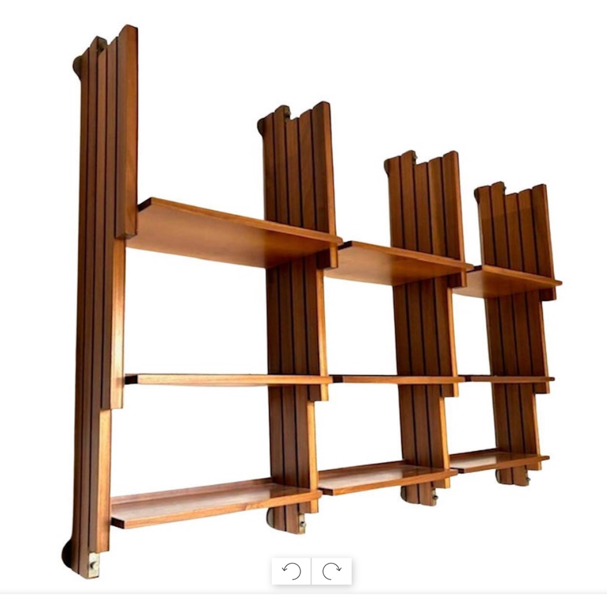 Large Mid-Century Italian wooden hanging bookcase, designed in the 1950s for the study of an important residence in central Italy.

This is an elegant bookcase, very refined in the smallest details, which can be easily dismantled and reassembled