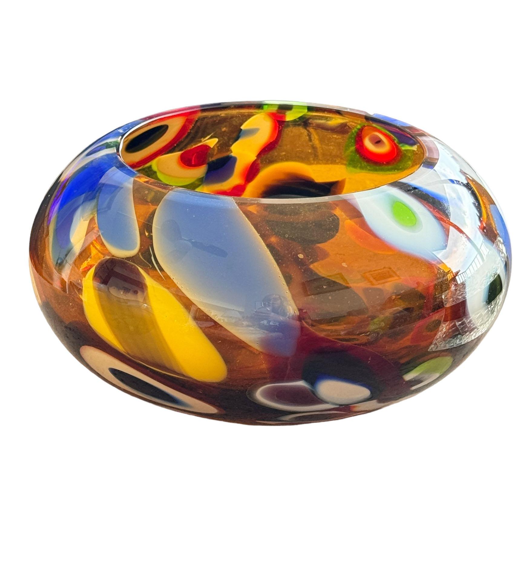 A wonderful mid century crystal bowl in a millefiori design. This is the perfect size to fill with flowers as a centerpiece or simply to sit on its own for a striking design feature in any room. The millefiori is very large and the colors are