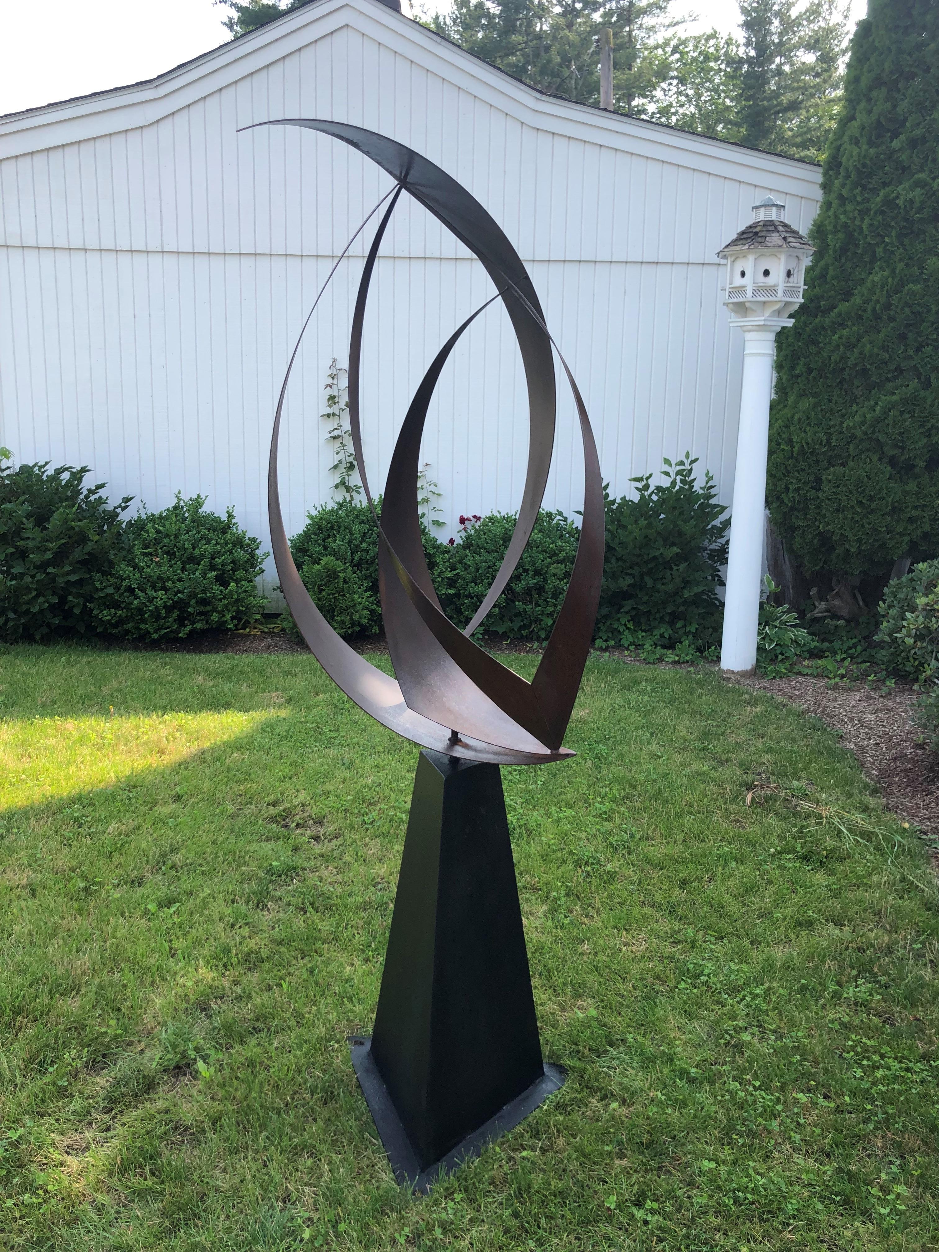 Large Mid-Century Modern abstract garden sculpture in the style of Harry Balmer. Articulating iron top on heavy black iron base. Great for in or outdoors. Measures: 74.50