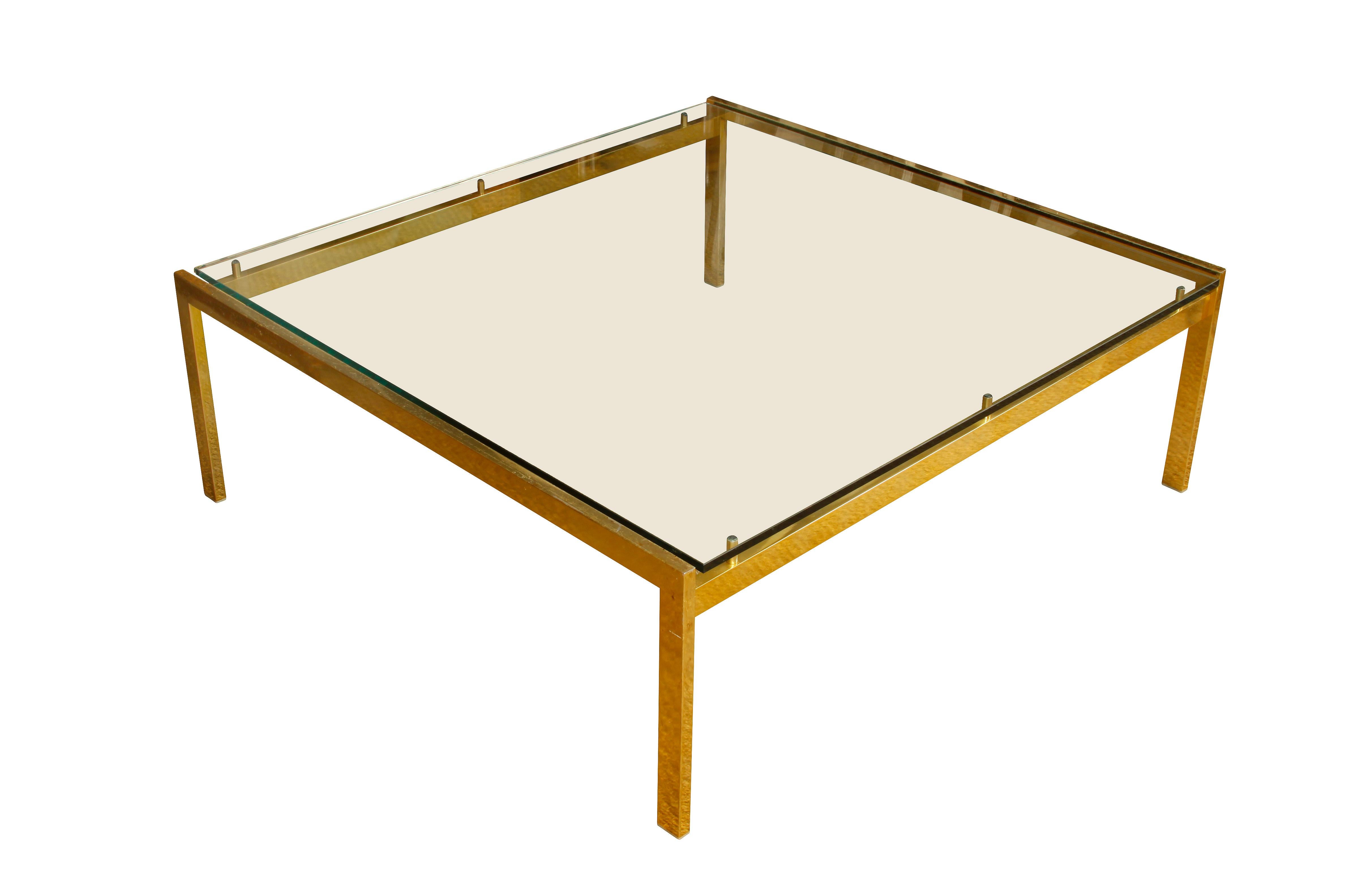 Large modern brass and glass cocktail table with a 42