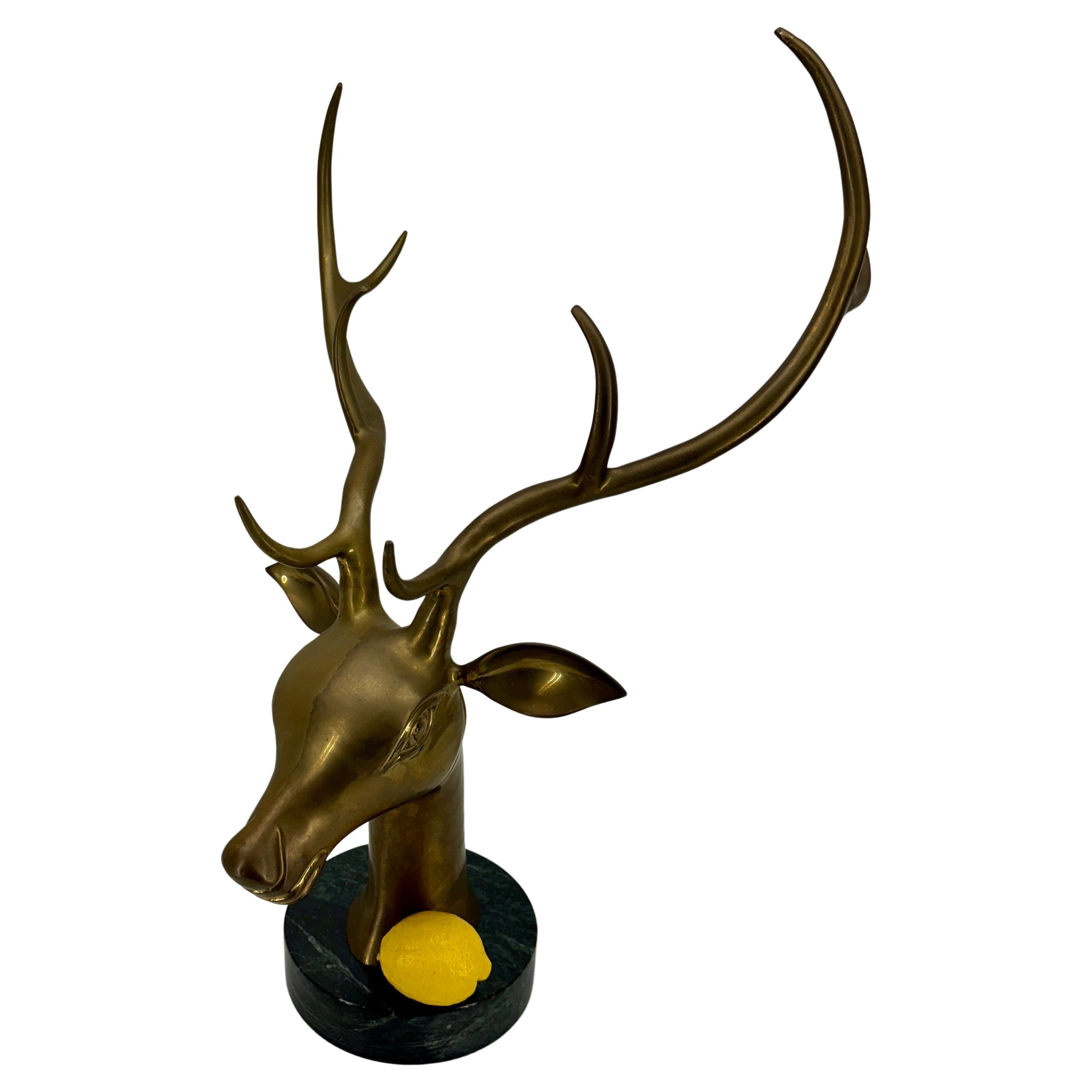 Brass Stag Deer Head with Antler on Marble Base MCM

Stunning large stag bust sculpture on a marble base. This decorative object certainly makes a statement either in a formal or informal home setting displayed on a coffee table as well as a home